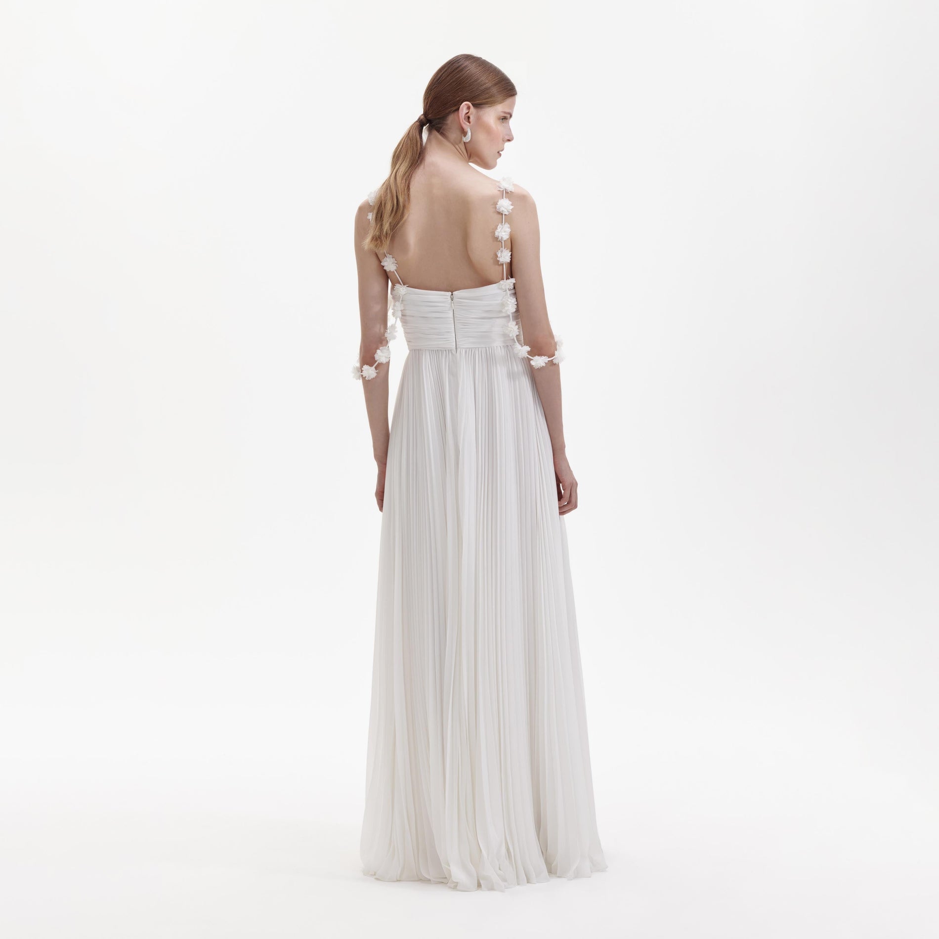 Back view of a woman wearing the White Chiffon Flower Maxi Dress