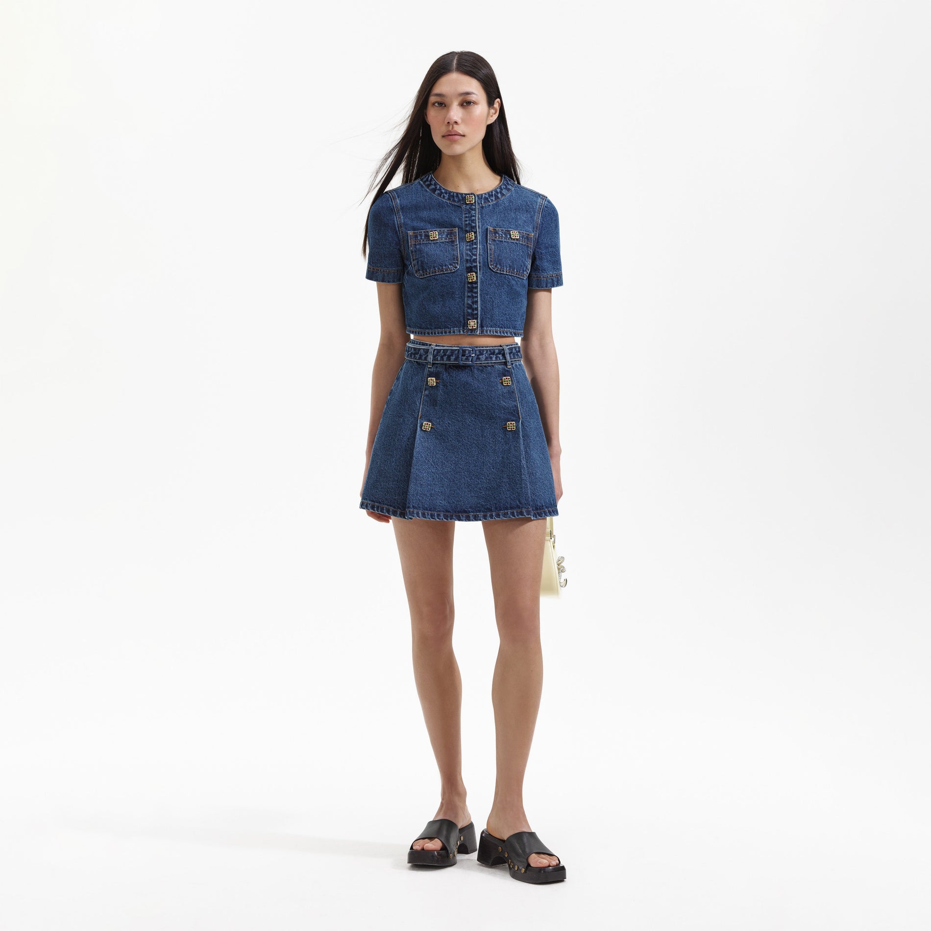 Front view of a woman wearing the Denim Short Sleeve Crop Top