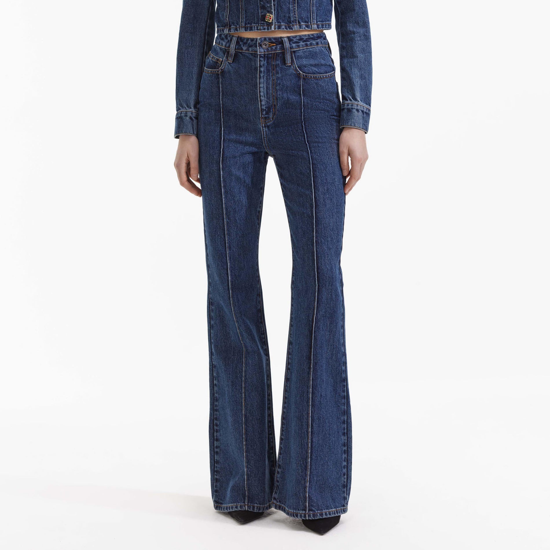 A close up of a woman wearing the Blue Bootcut Denim Jeans