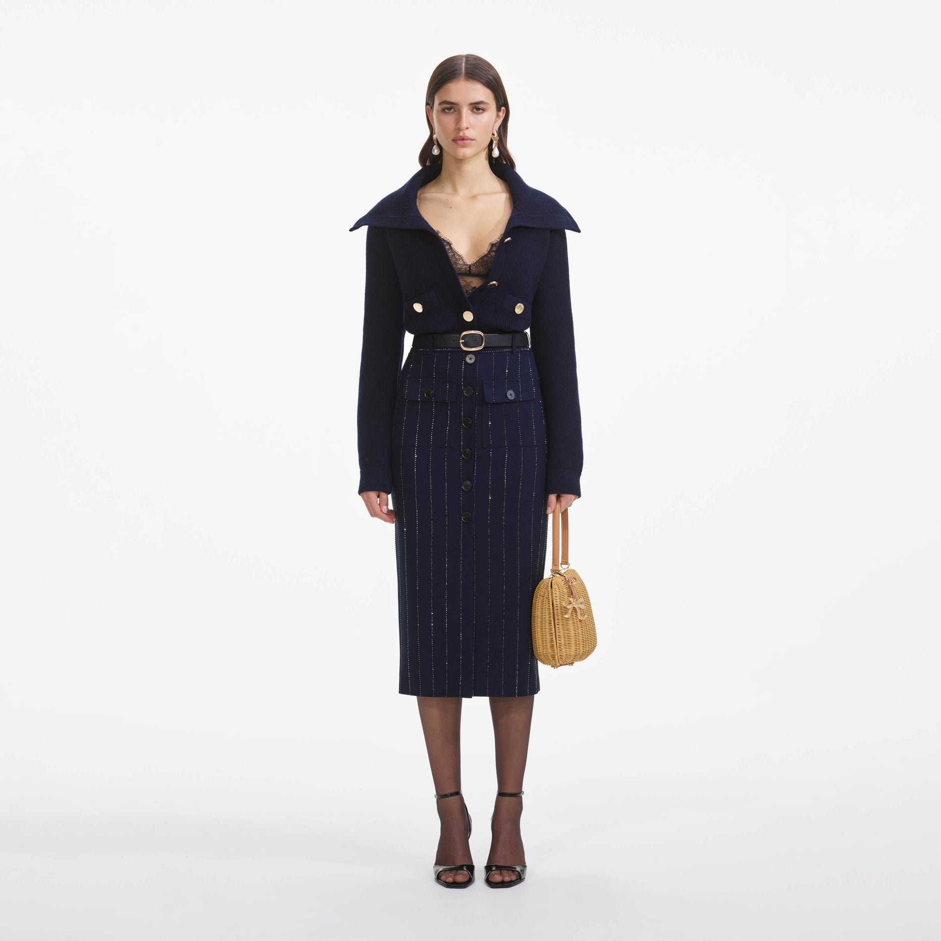 Front view of a woman wearing the Navy Relaxed Fit Cardigan