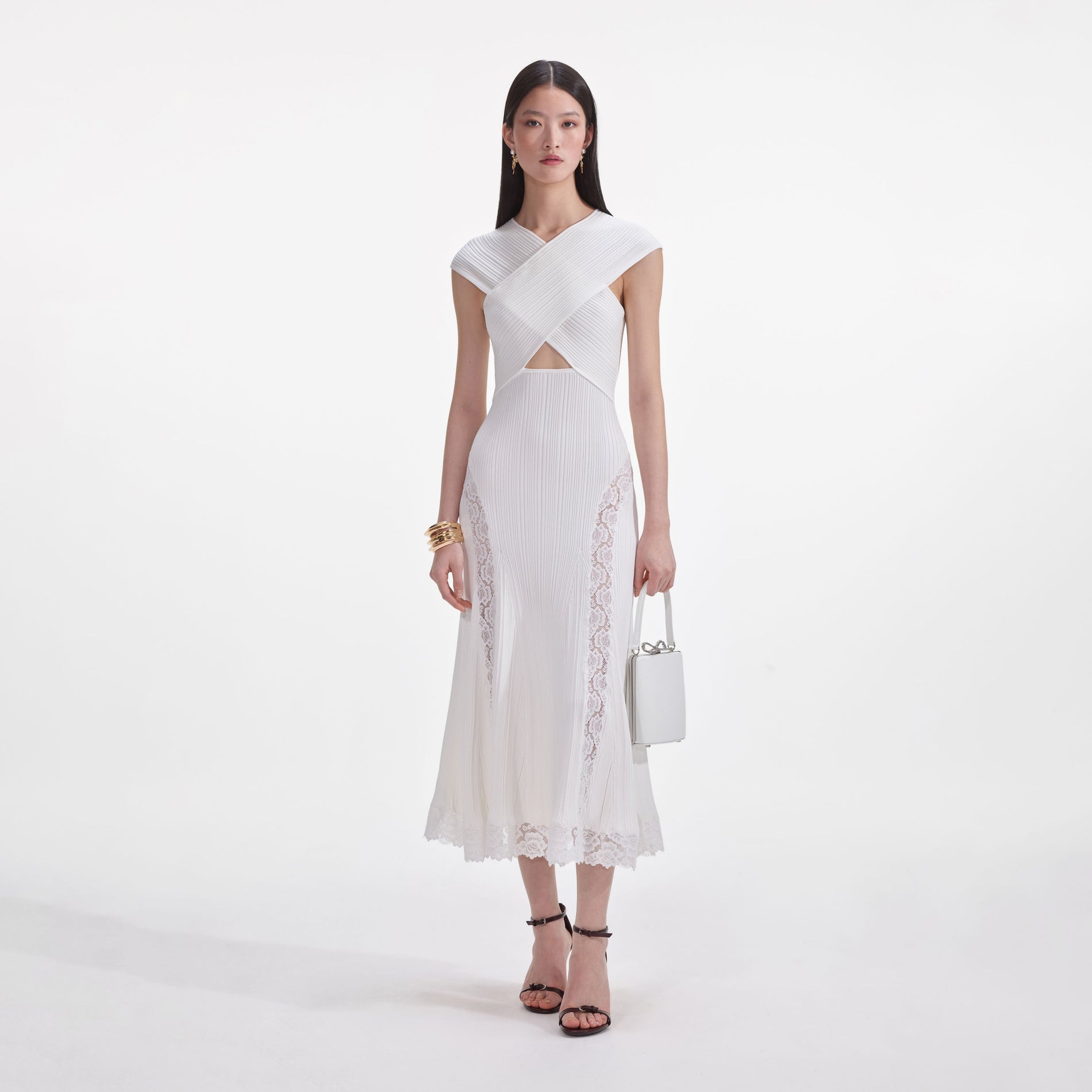 Front view of a woman wearing the White Knit Lace Insert Midi Dress