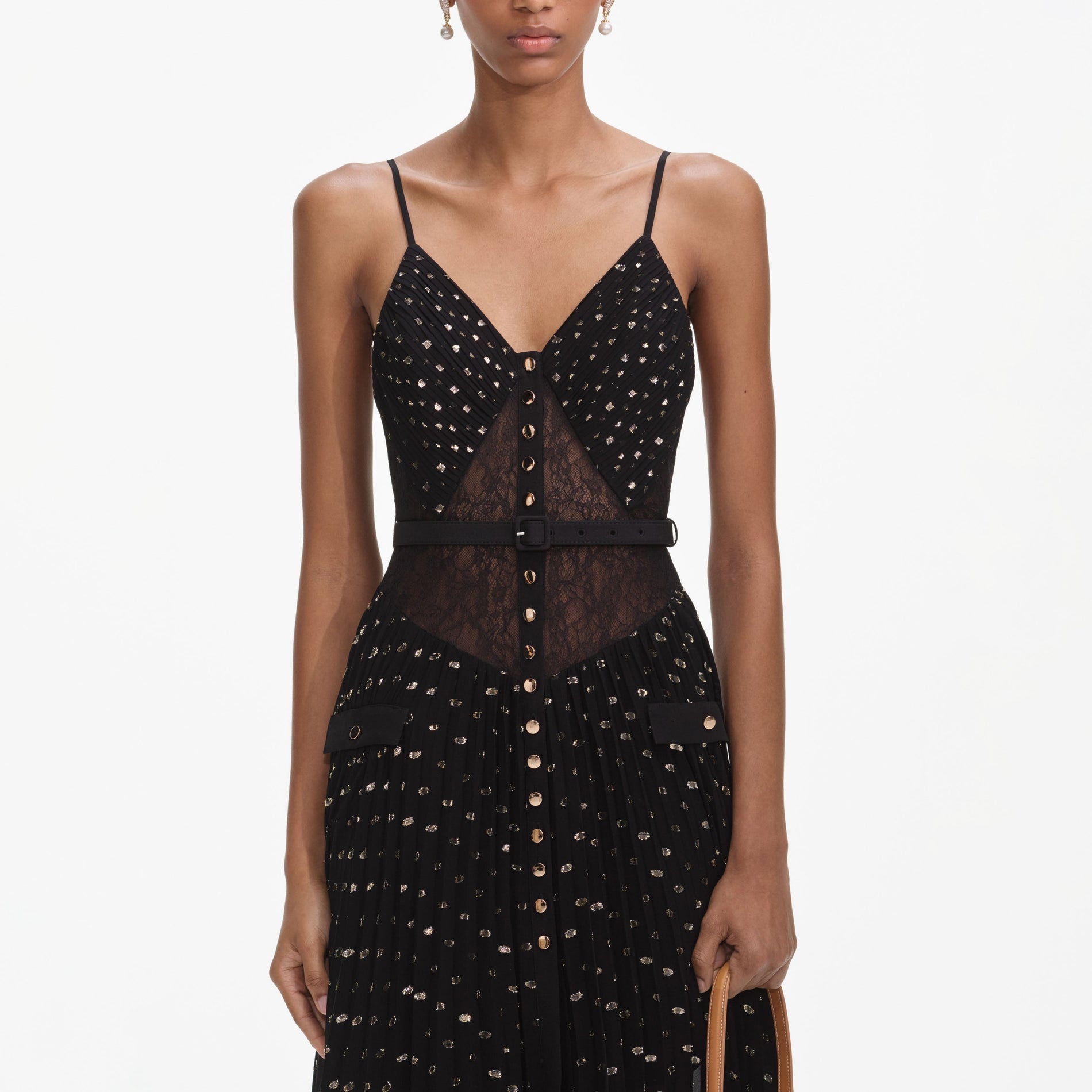 A close up of a woman wearing the Black And Gold Chiffon Maxi Dress