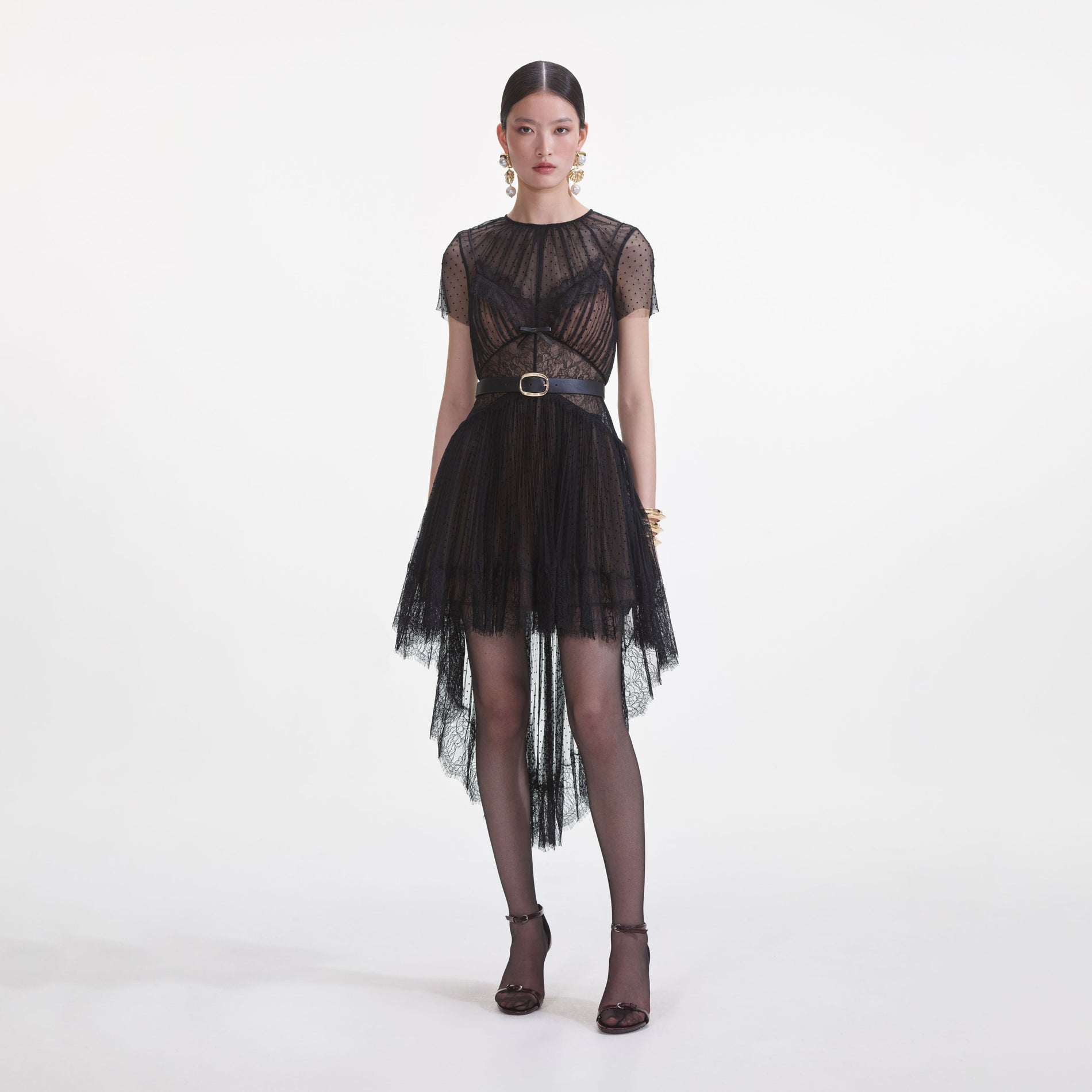 Front view of a woman wearing the Black Dot Mesh Mini Dress