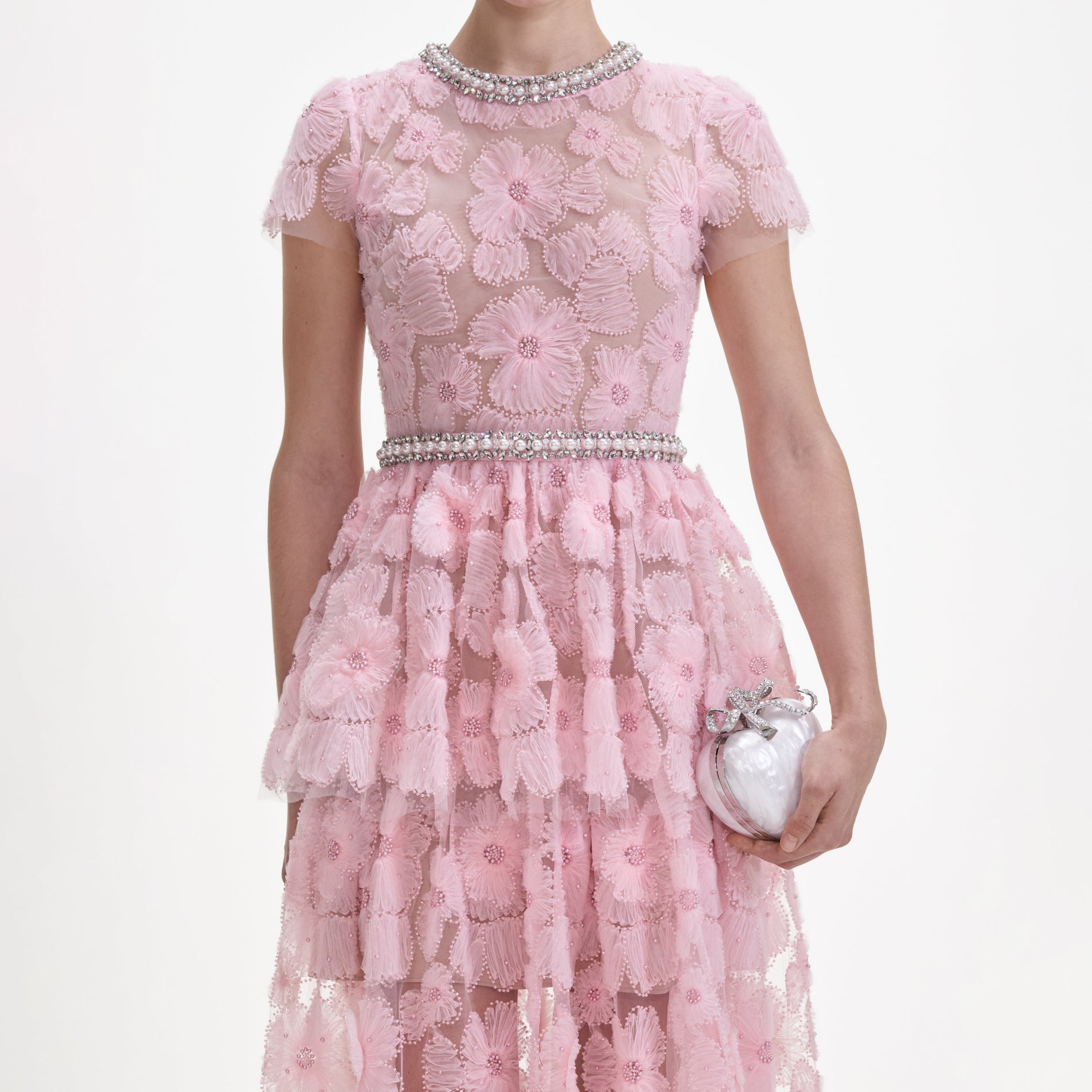 A close up of a woman wearing the Pink Embellished Tulle Maxi Dress