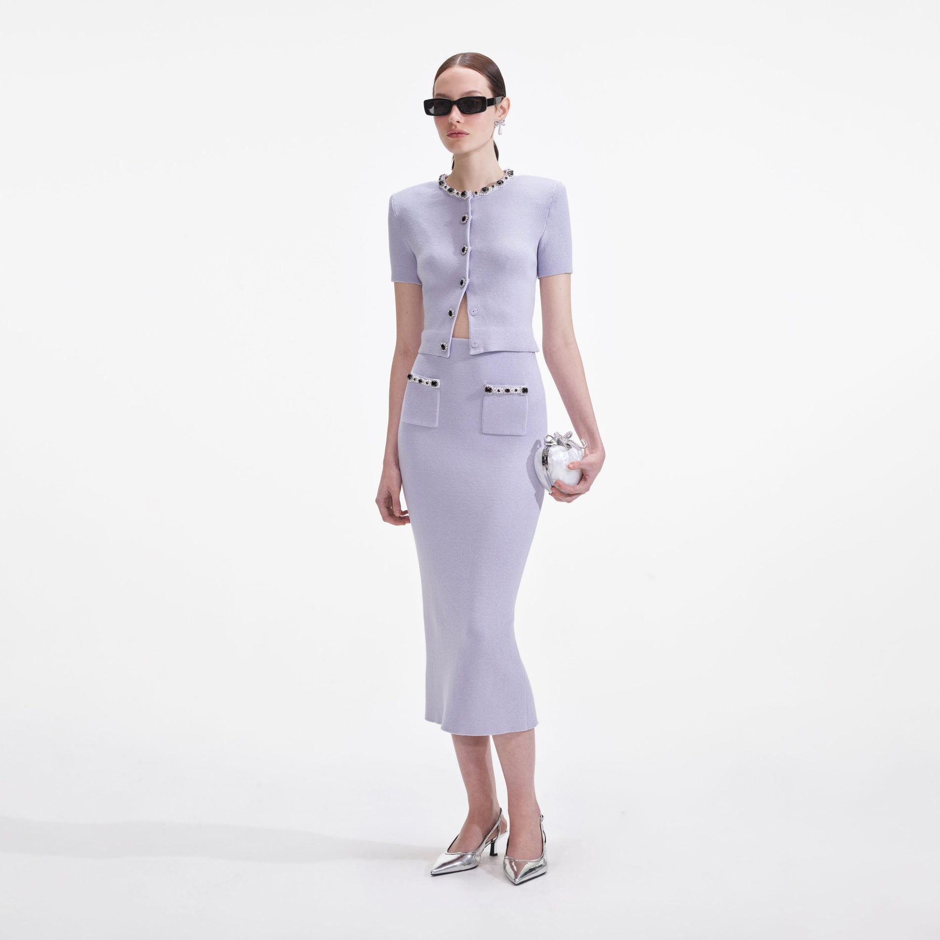 Side view of a woman wearing the Lilac Embellished Knit Top