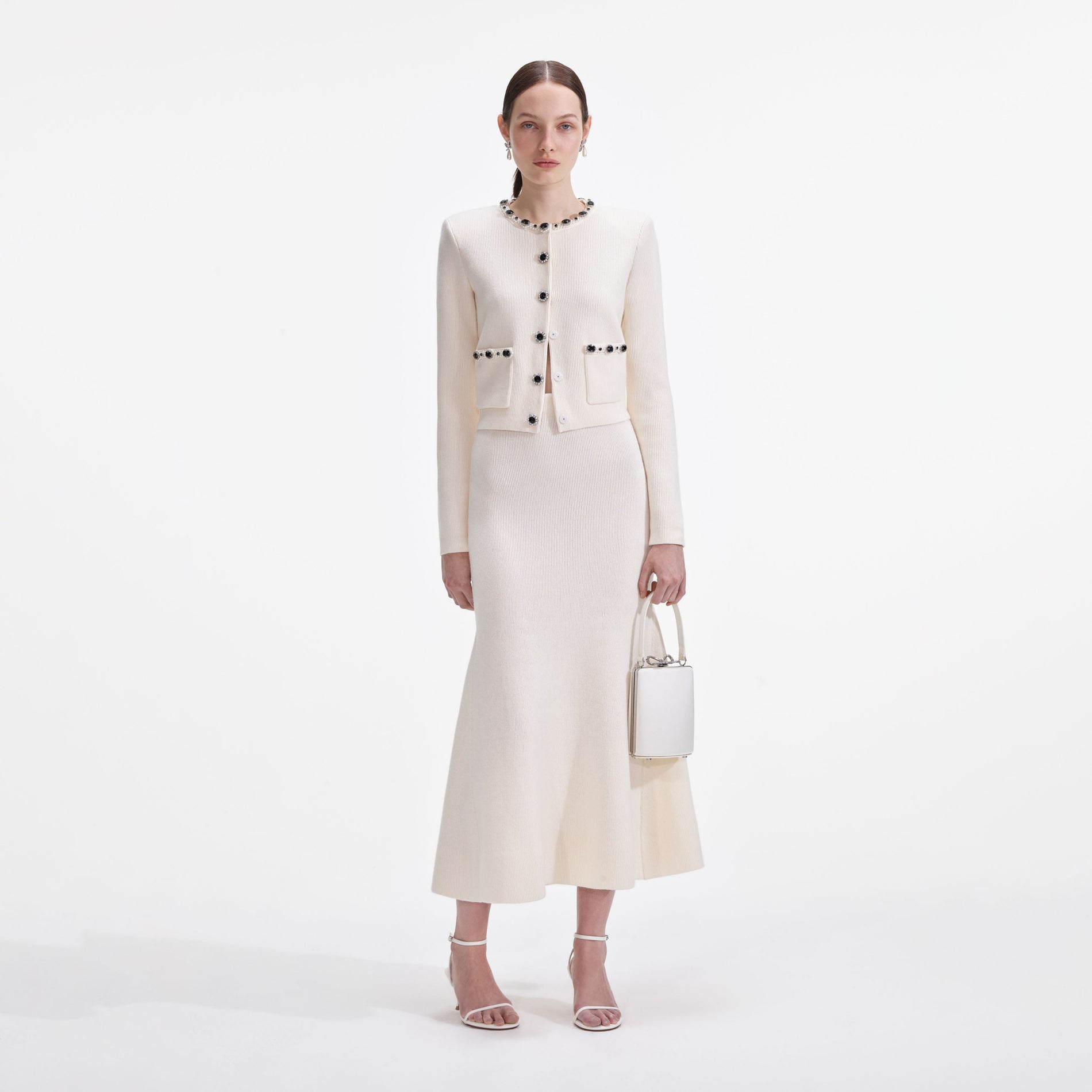 Front view of a woman wearing the Cream Embellished Cardigan