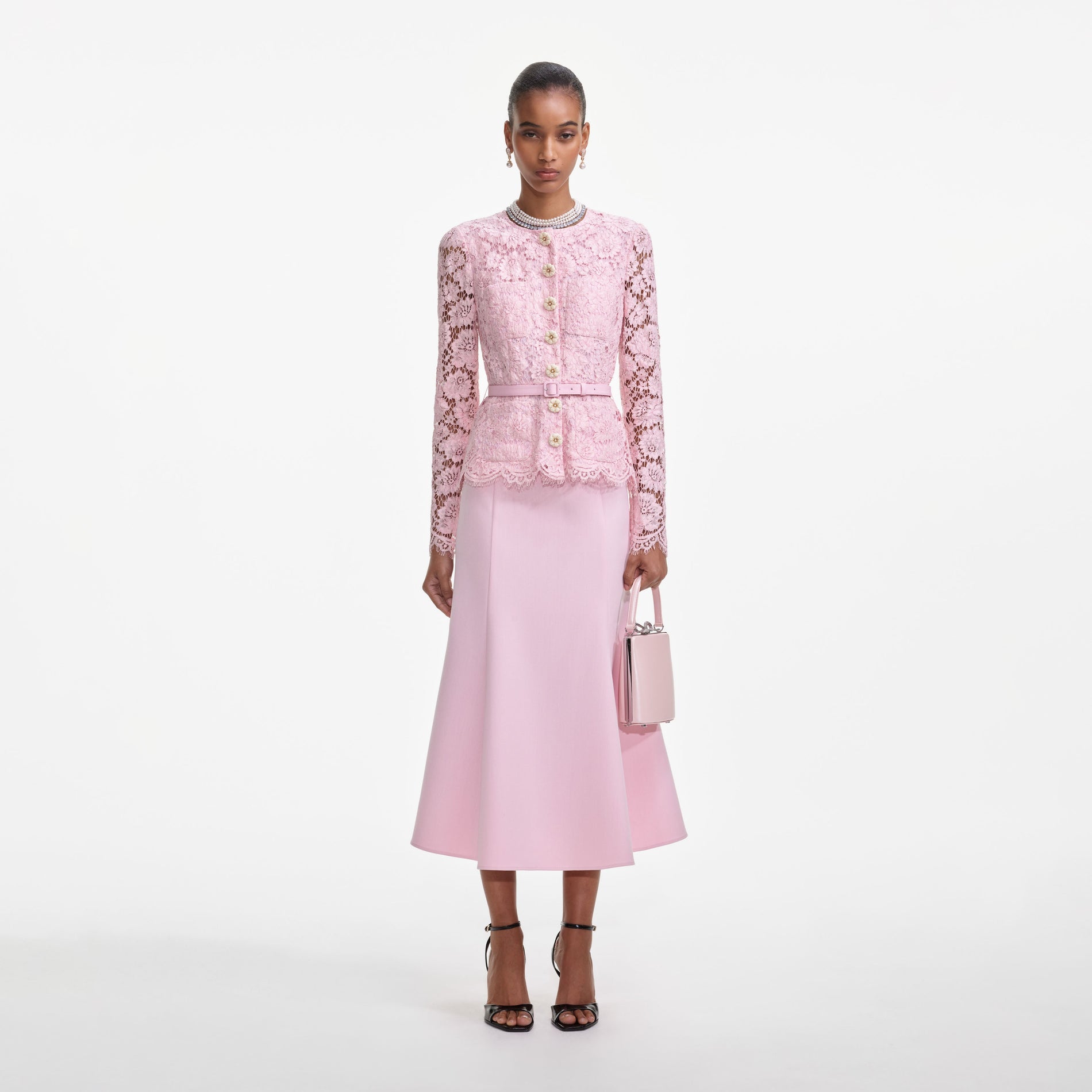 Front view of a woman wearing the Pink Tailored Lace Midi Dress