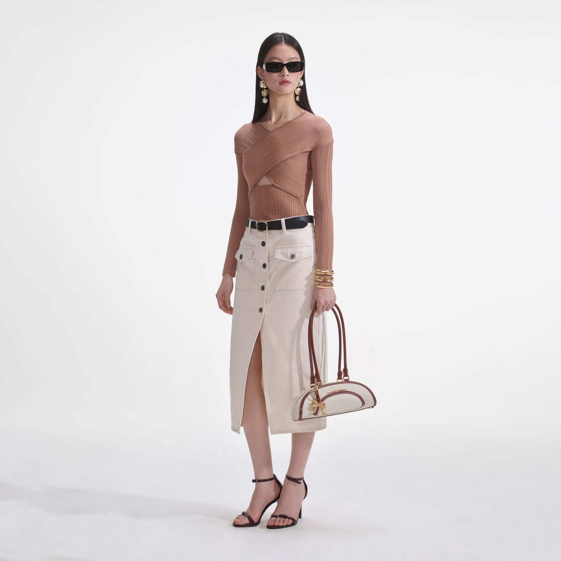 Side view of a woman wearing the Beige Ribbed Knit Wrap Top