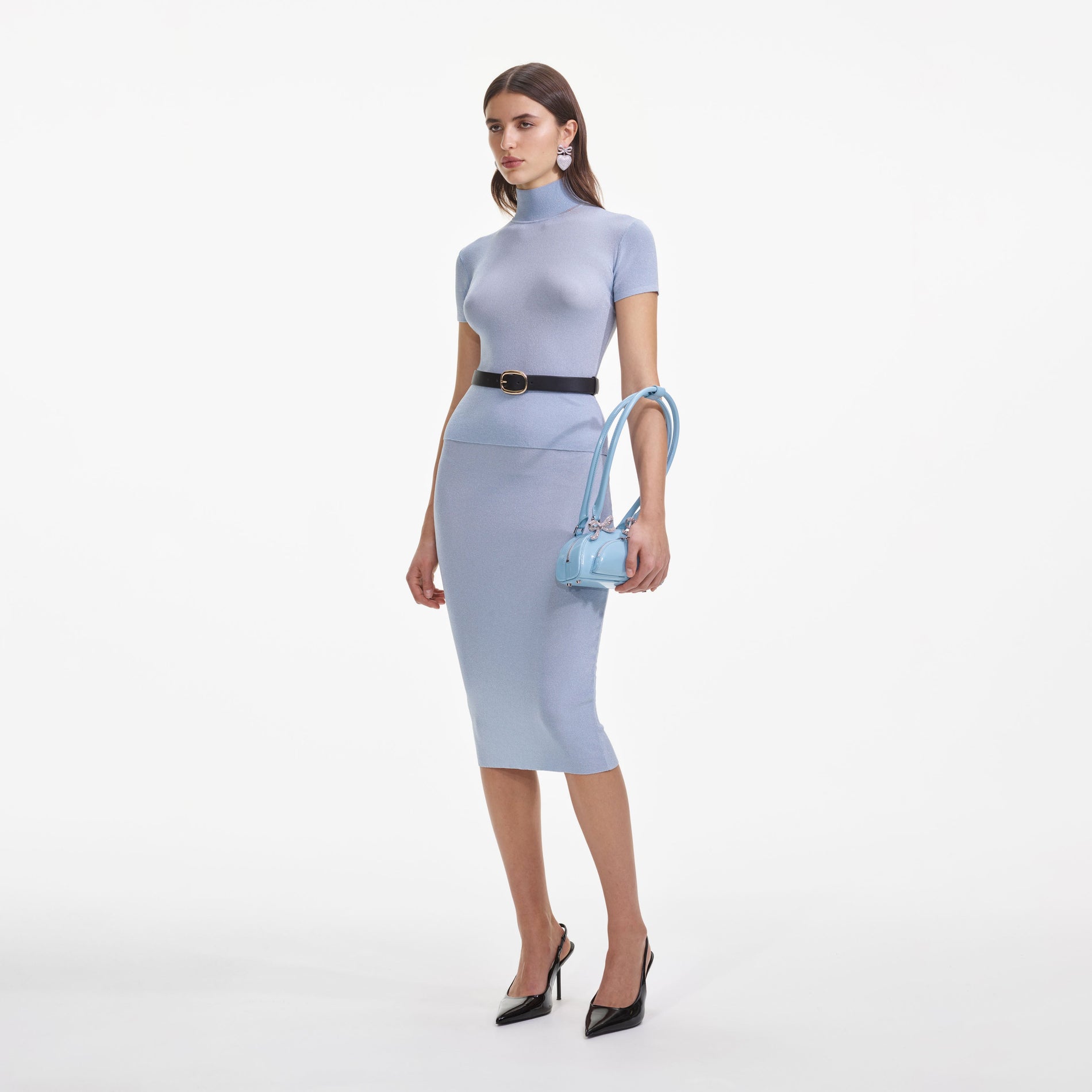 Side view of a woman wearing the Blue Viscose Knit Short Sleeve Top