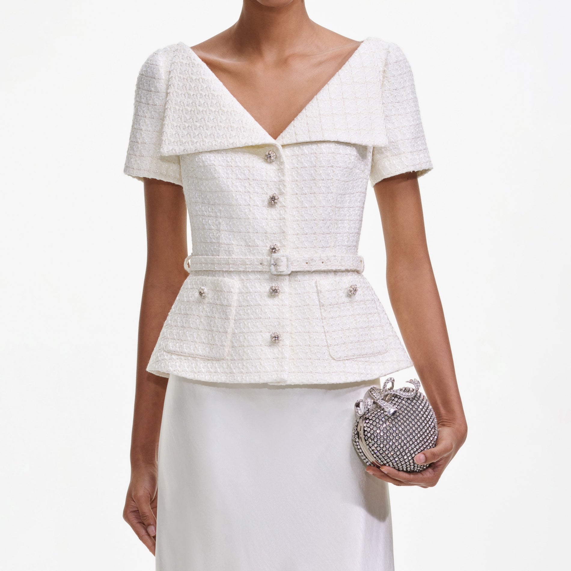 A close up of a woman wearing the Cream Boucle Tailored Maxi Dress