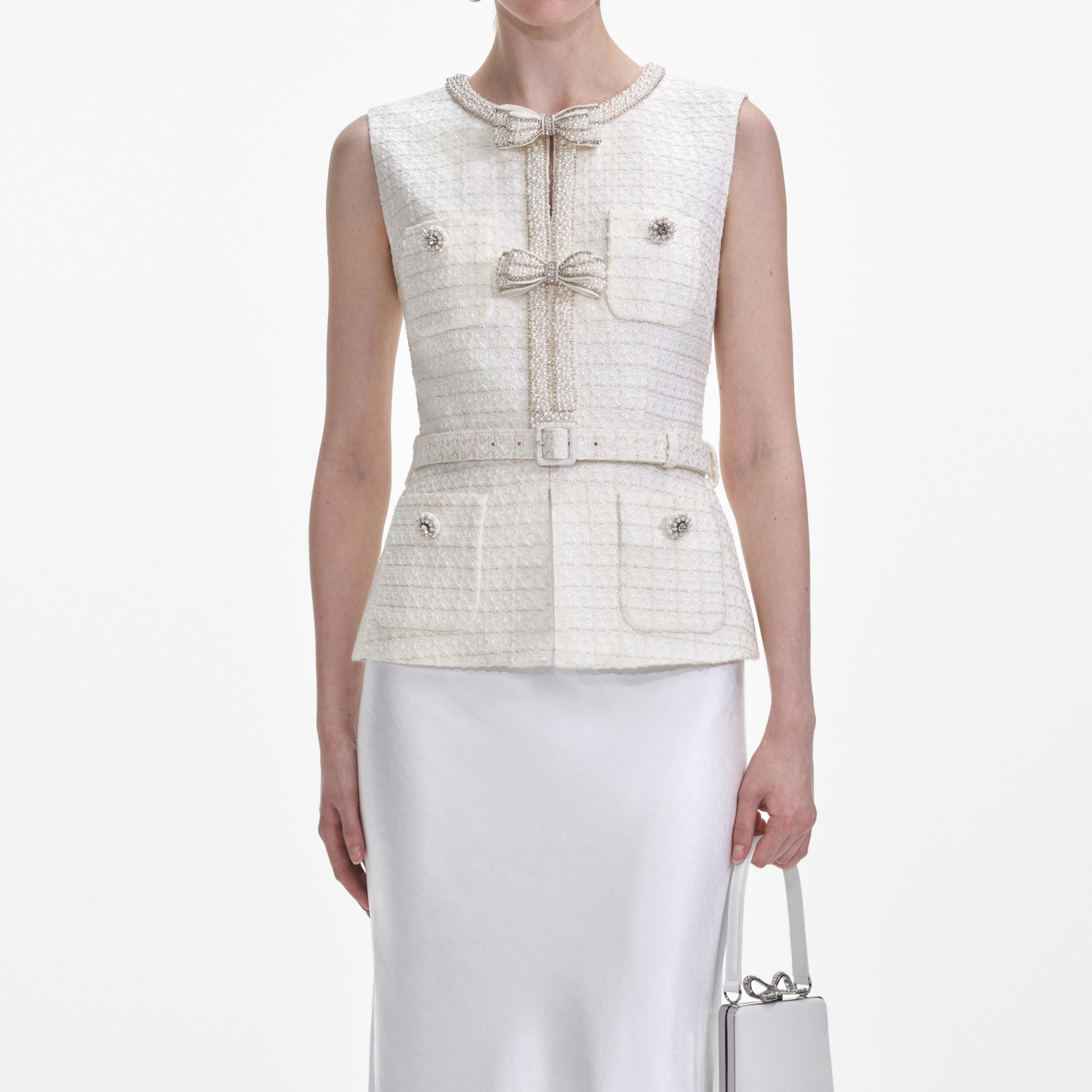 A close up of a woman wearing the Cream Boucle Midi Dress