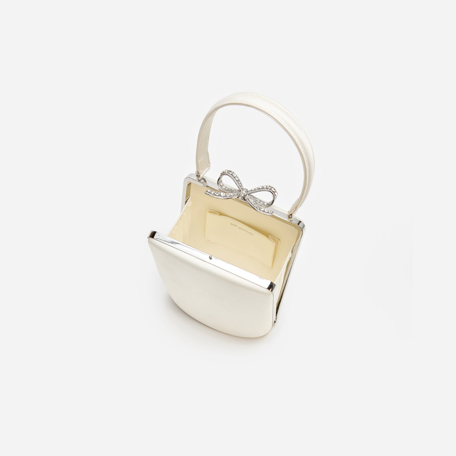 A photo of the Champagne Satin Mini Bow Bag