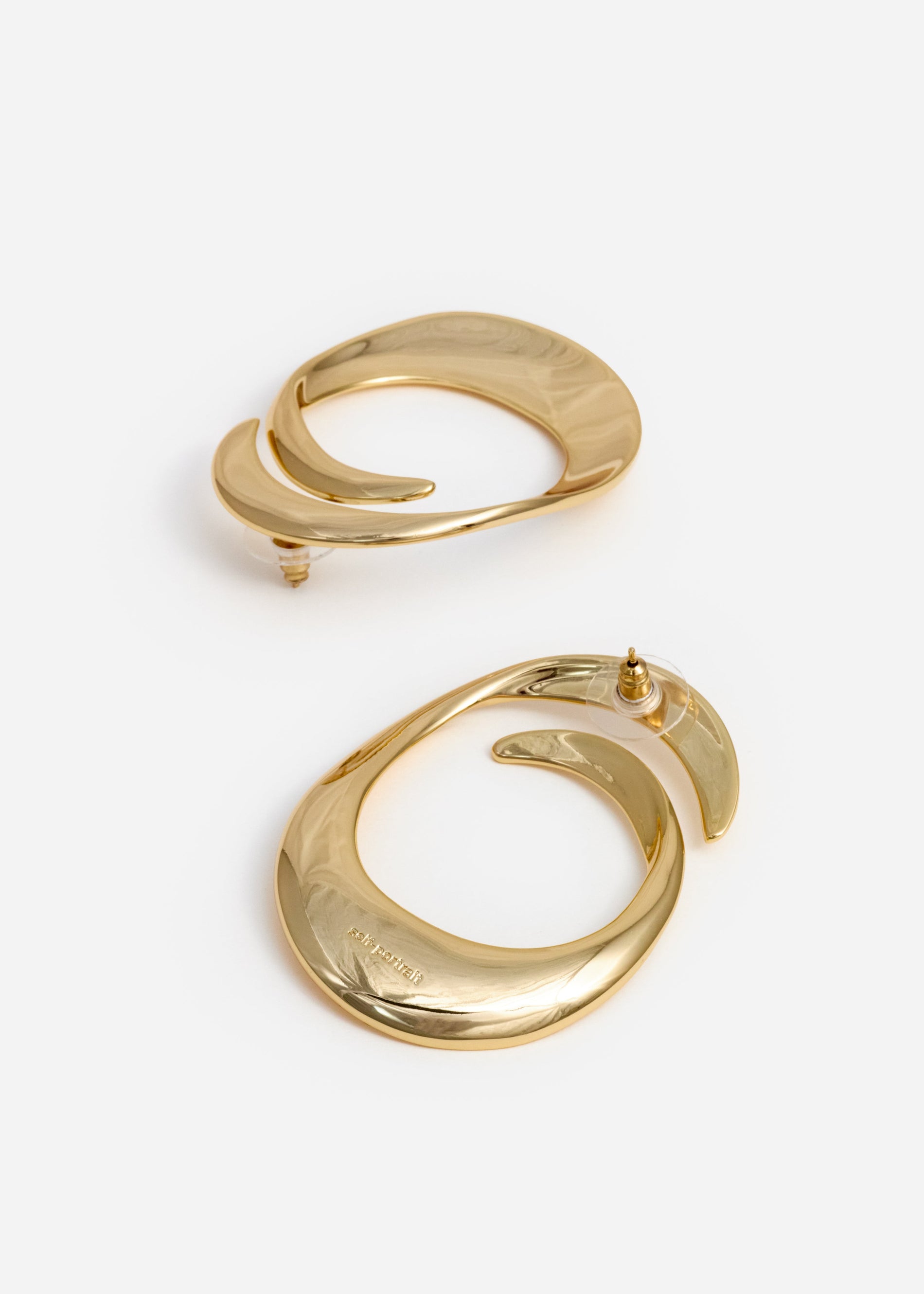A photo of the Gold Swirl Earrings