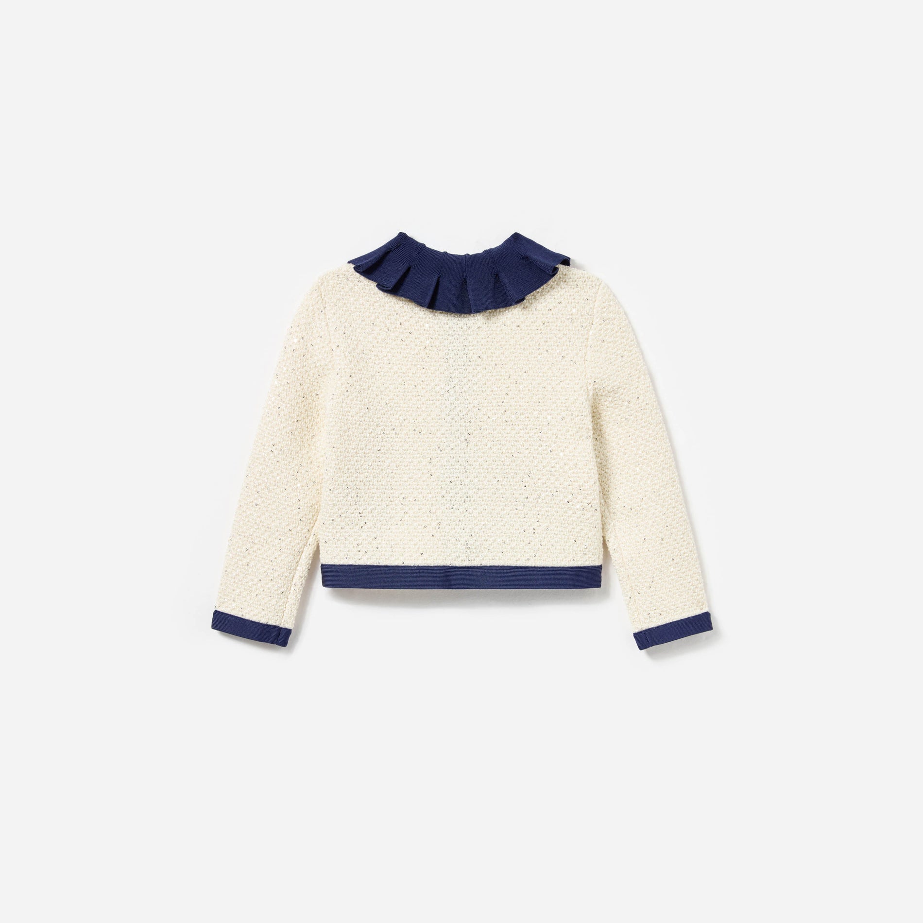 Side view of a woman wearing the Cream Sequin Knit Cardigan