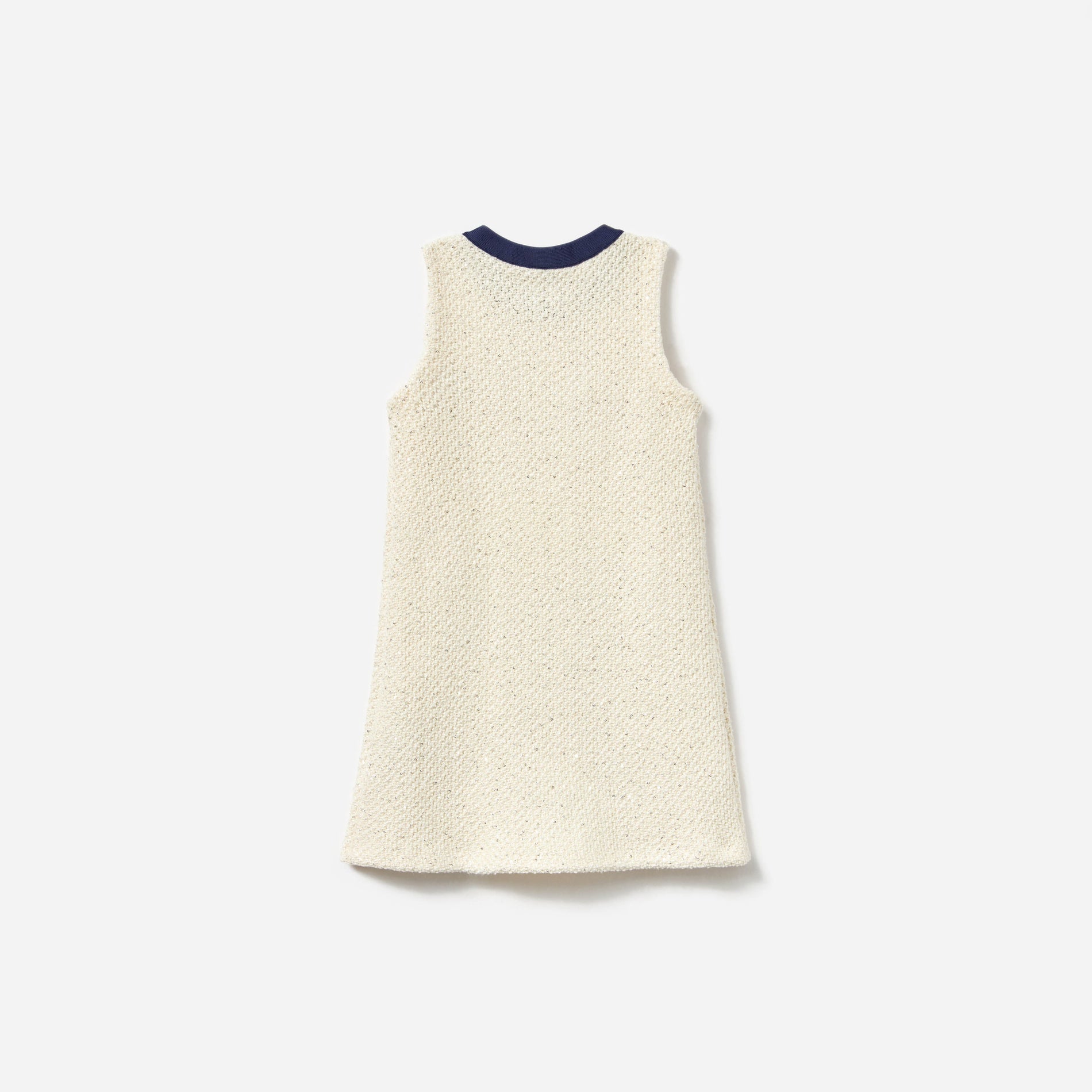 Side view of a woman wearing the Cream Sequin Knit Dress