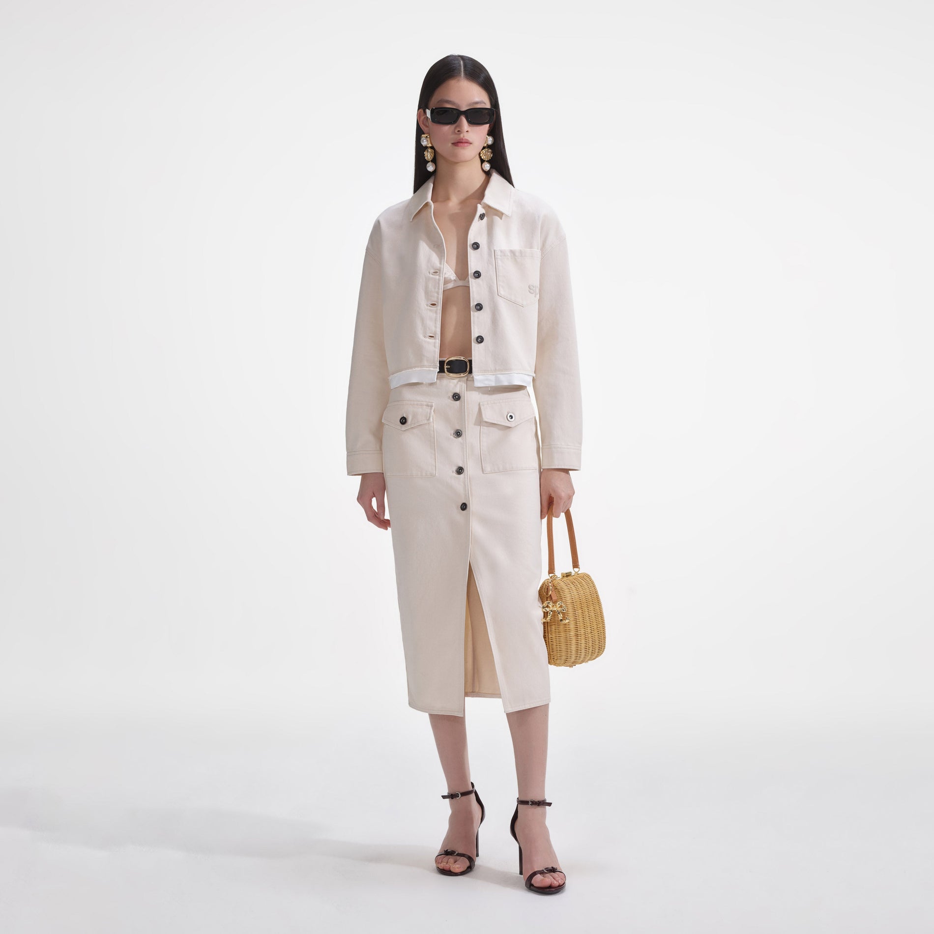 Front view of a woman wearing the Cream Denim Jacket