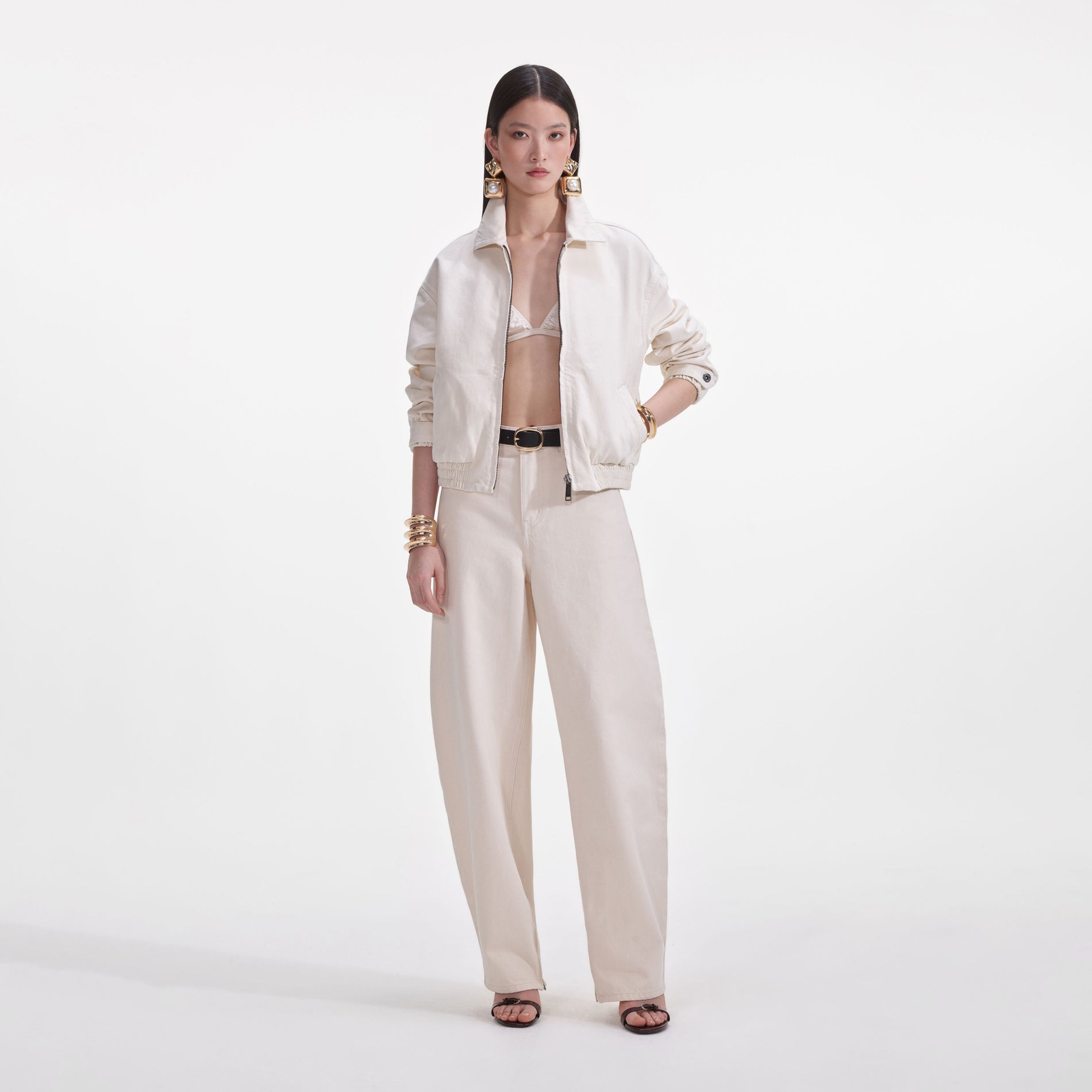 A close up of a woman wearing the Cream Lightweight Denim Jacket