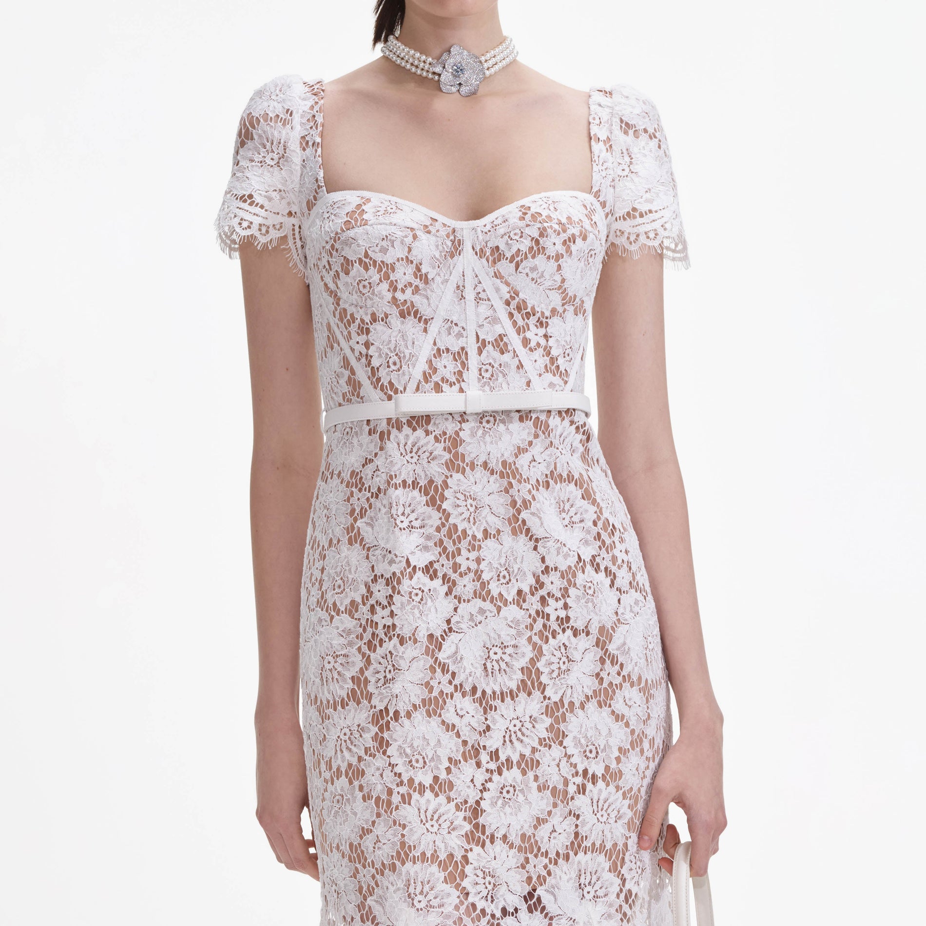 A close up of a woman wearing the White Fine Lace Midi Dress