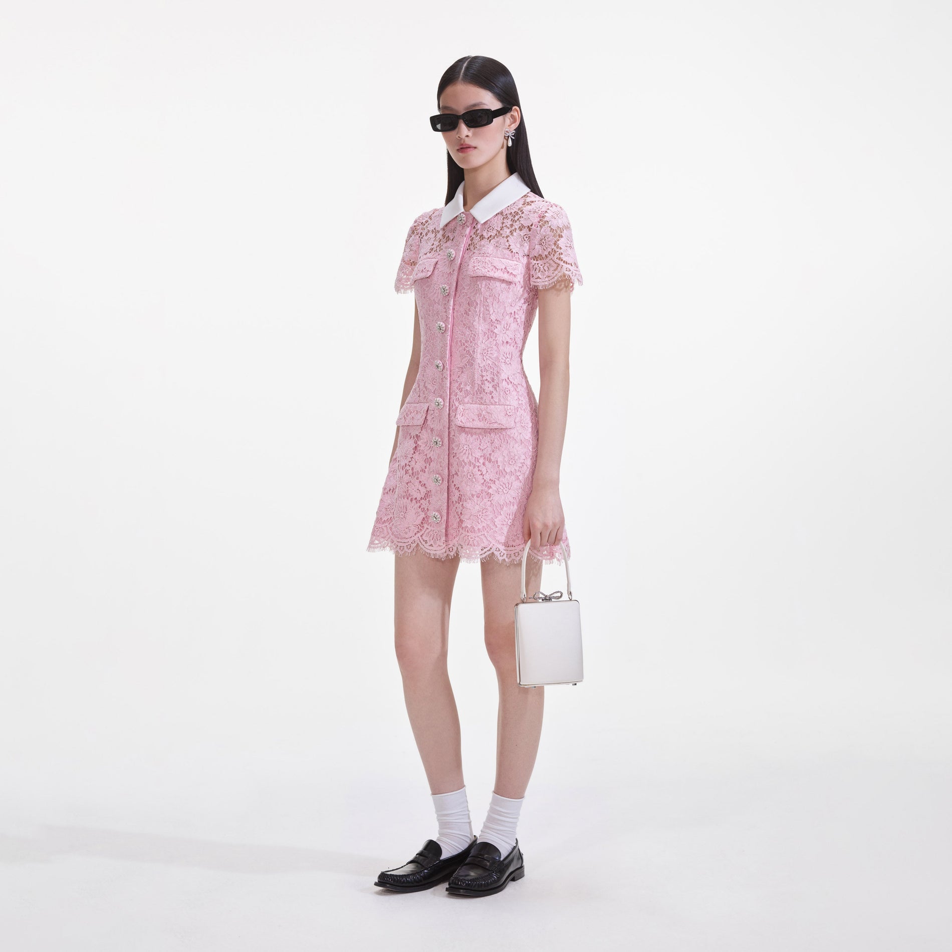 Side view of a woman wearing the Pink Lace Collared Mini Dress