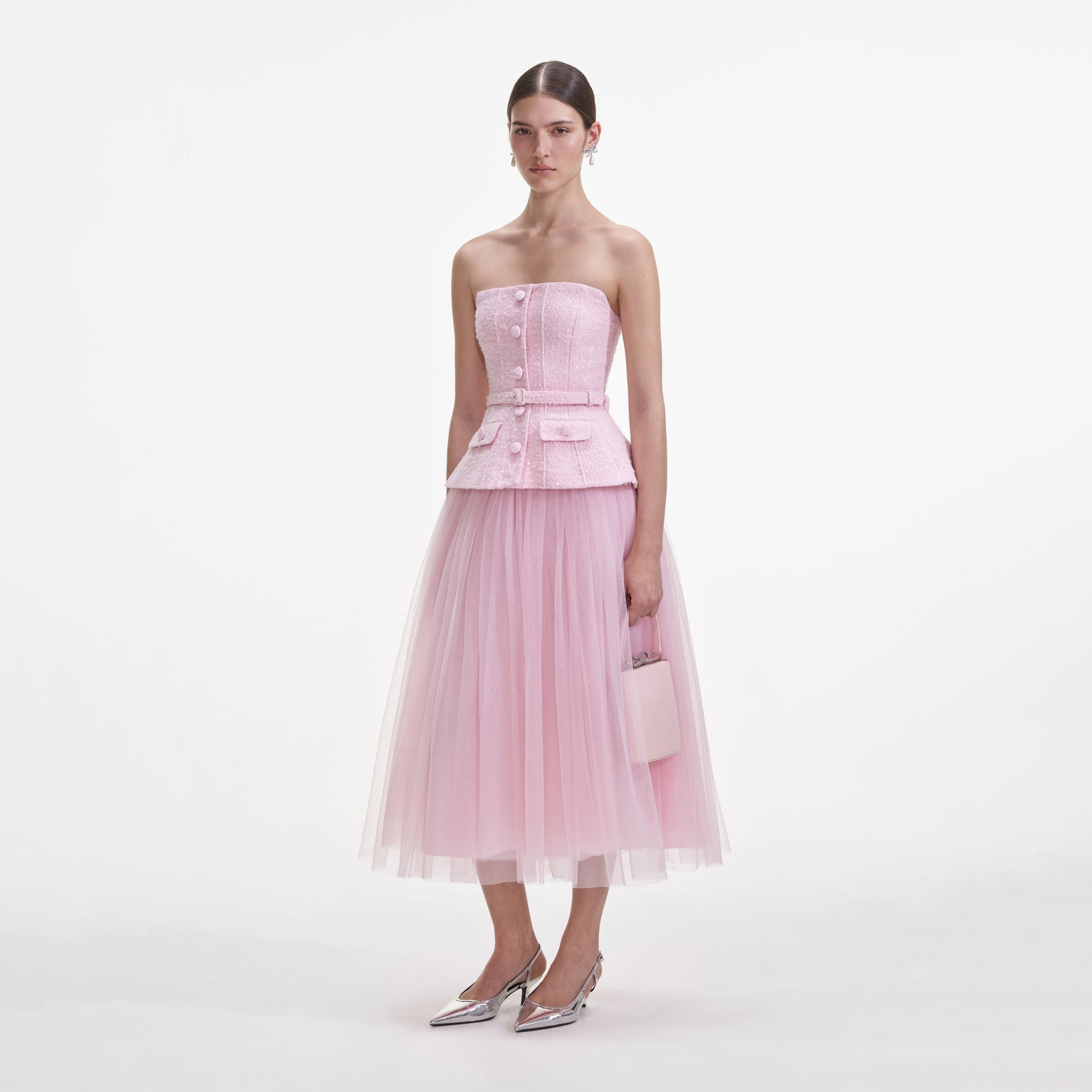 Side view of a woman wearing the Pink Boucle Tulle Midi Dress