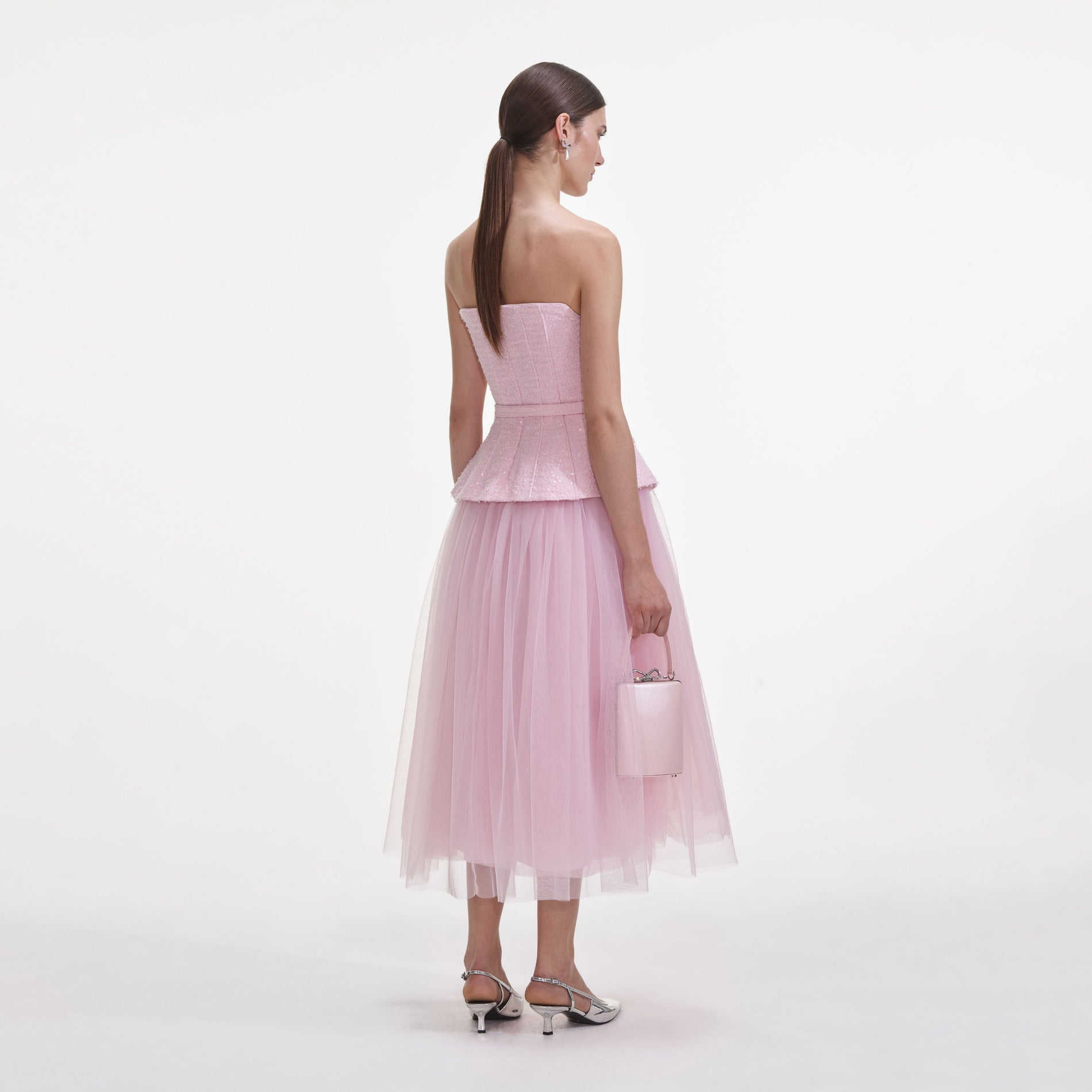Back view of a woman wearing the Pink Boucle Tulle Midi Dress
