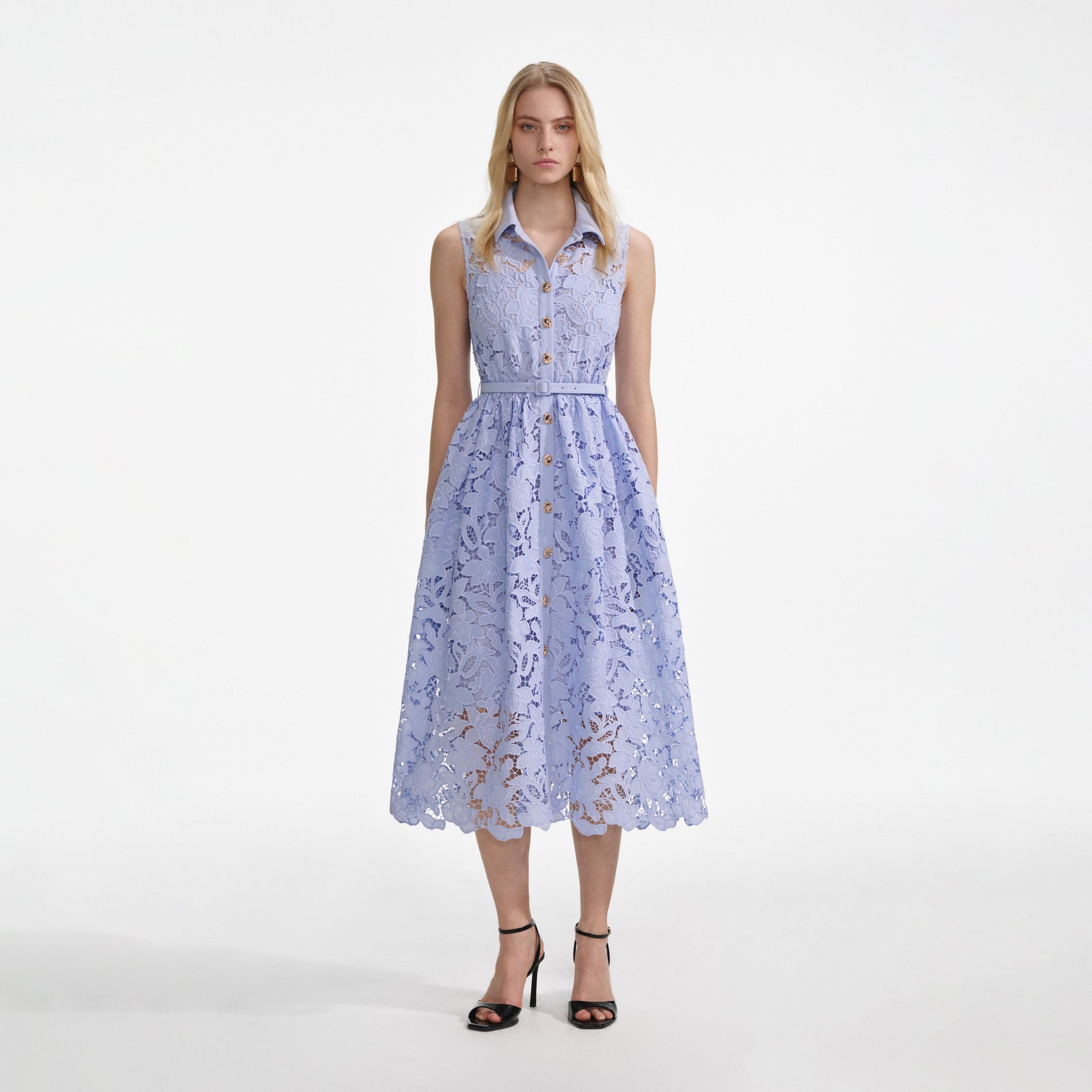 Front view of a woman wearing the Blue Lace Sleeveless Midi Dress