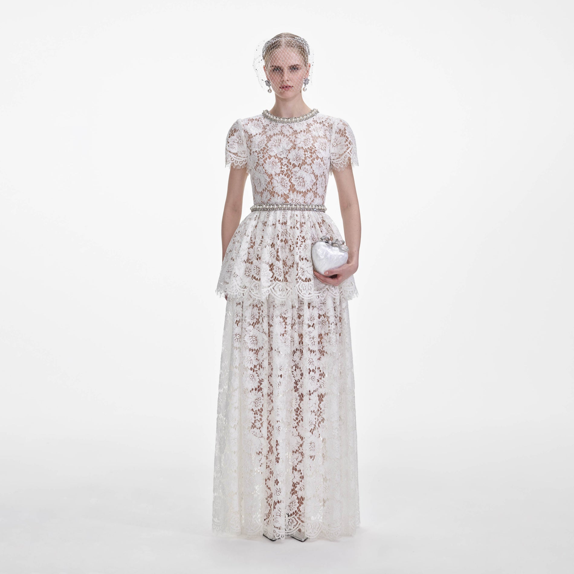 Front view of a woman wearing the White Lace Tiered Maxi Dress