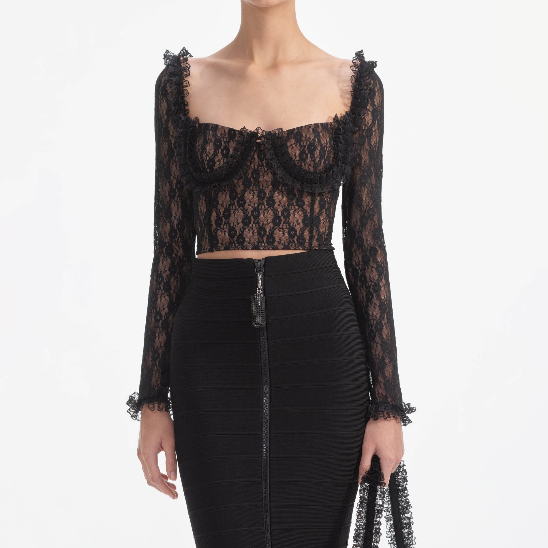 A close up of a woman wearing the Black Lace Ruffle Top