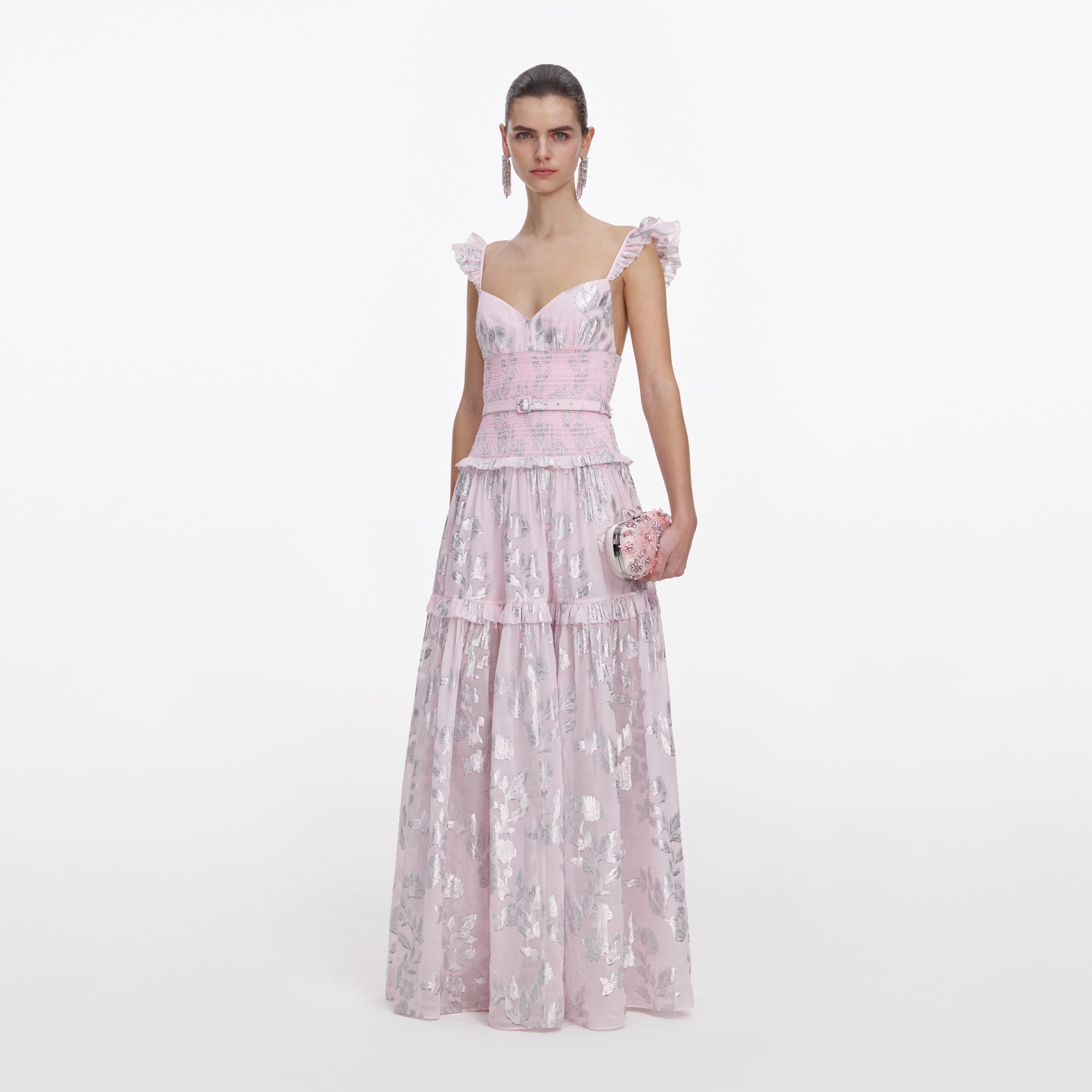 Side view of a woman wearing the Pink Metallic Chiffon Flower Maxi Dress