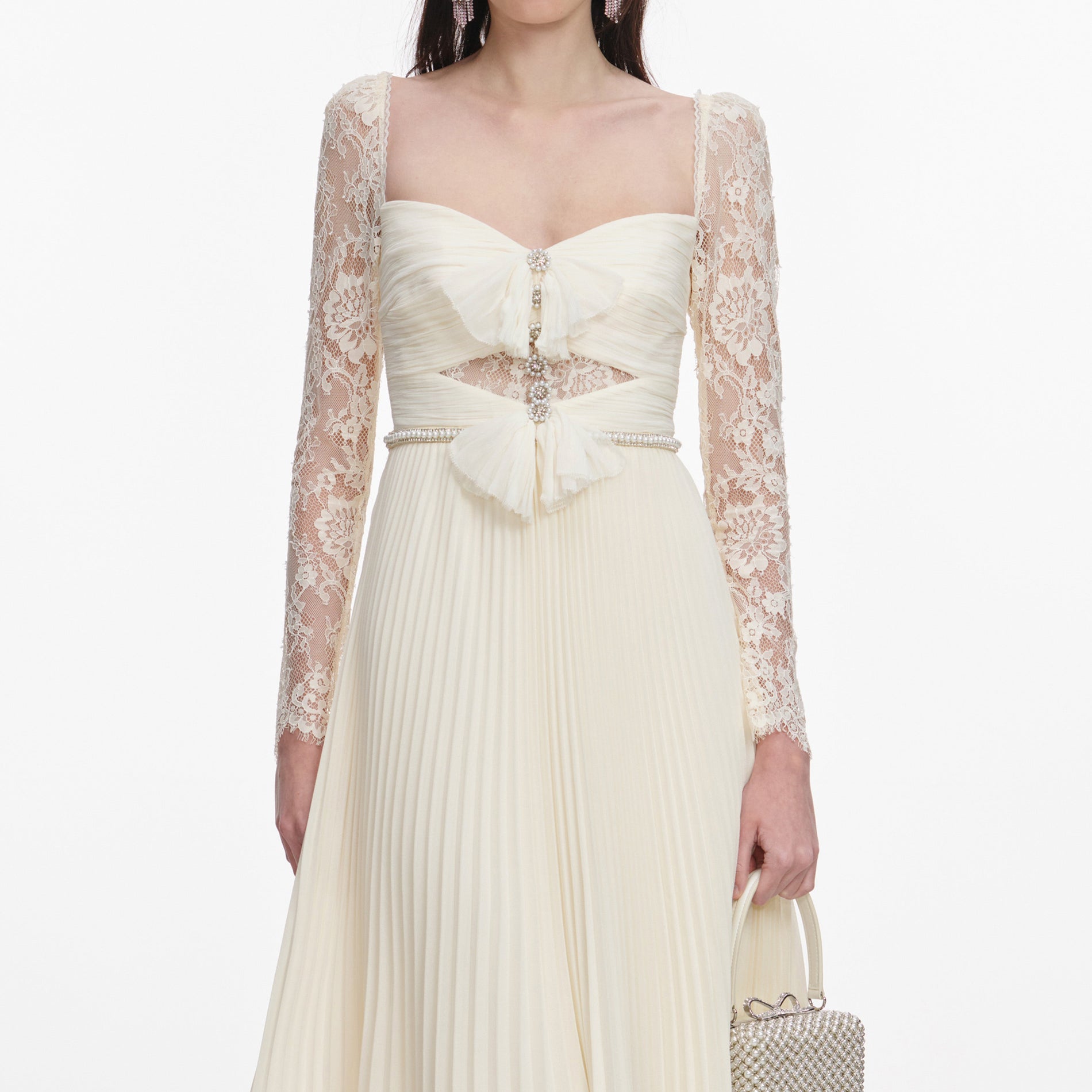 A close up of a woman wearing the Cream Chiffon Lace Midi Dress