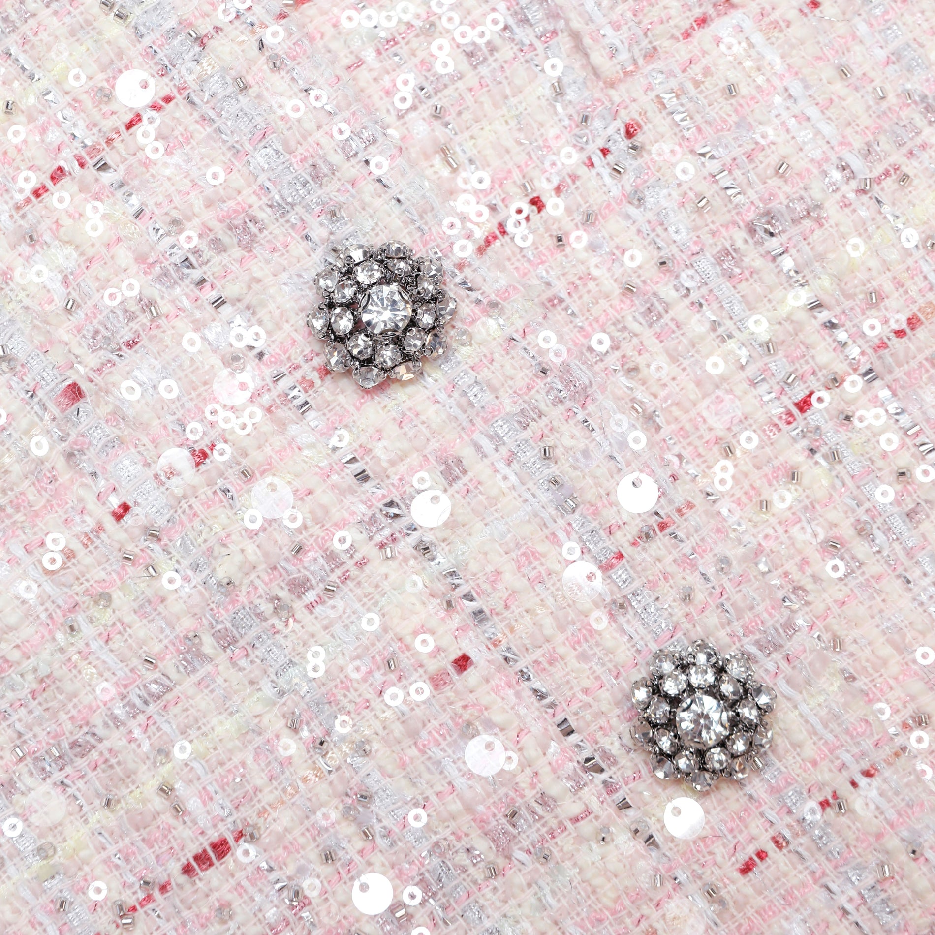 A close up of the fabric for the Pink Sequin Boucle Jacket