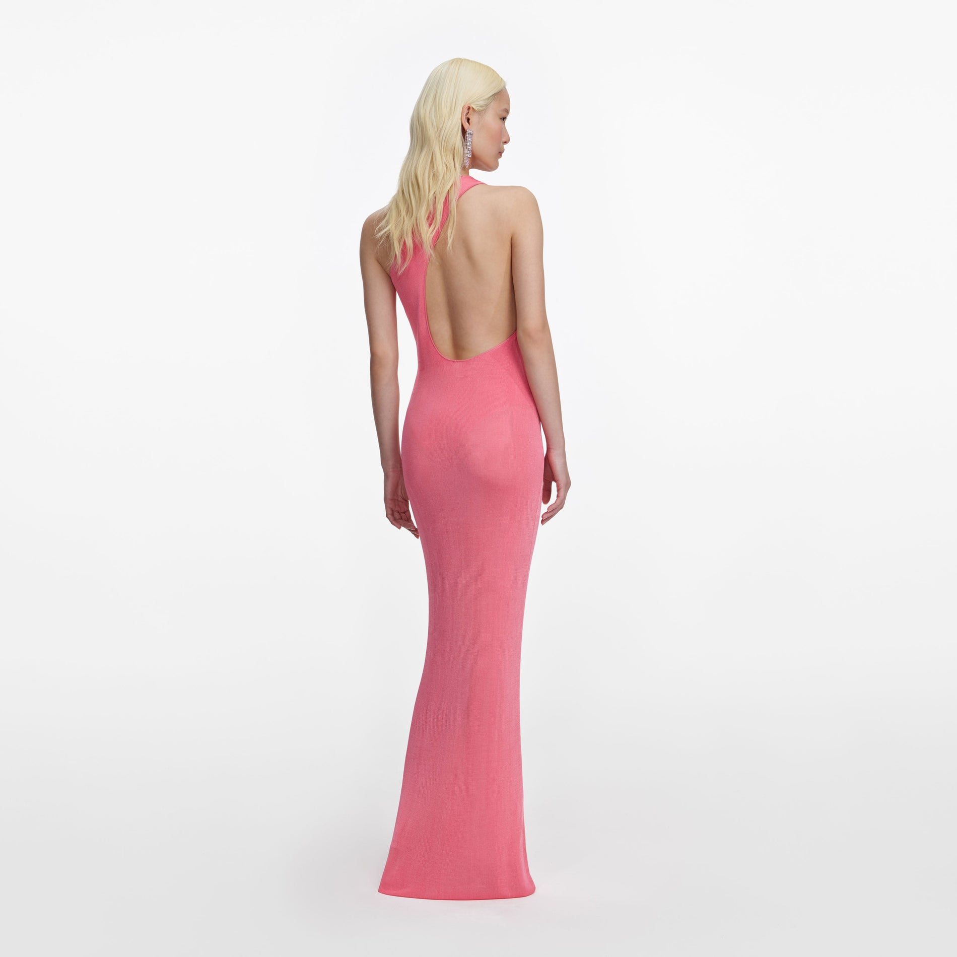 Back view of a woman wearing the Pink Viscose Knit One Shoulder Maxi Dress