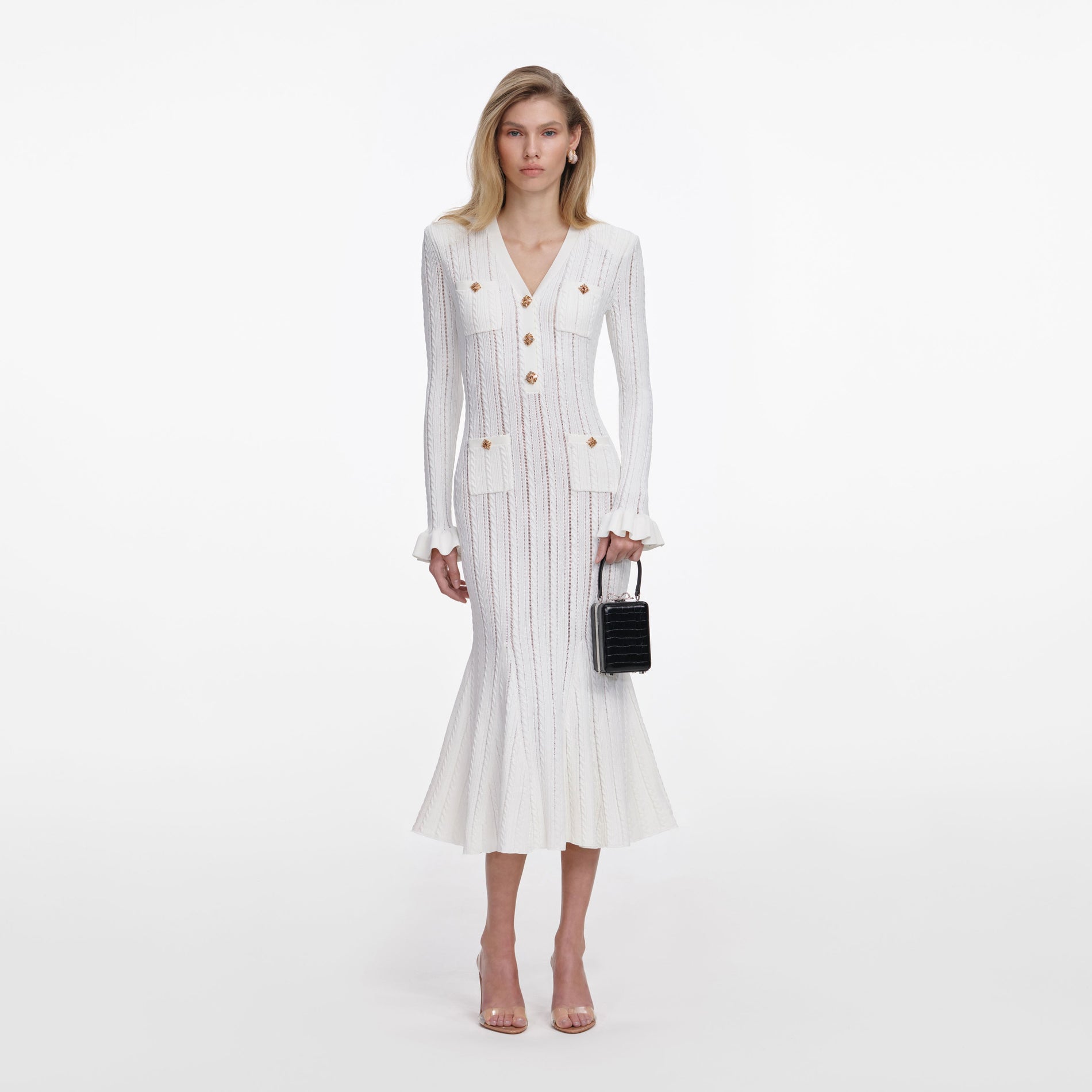Front view of a woman wearing the White Pointelle Knit Midi Dress