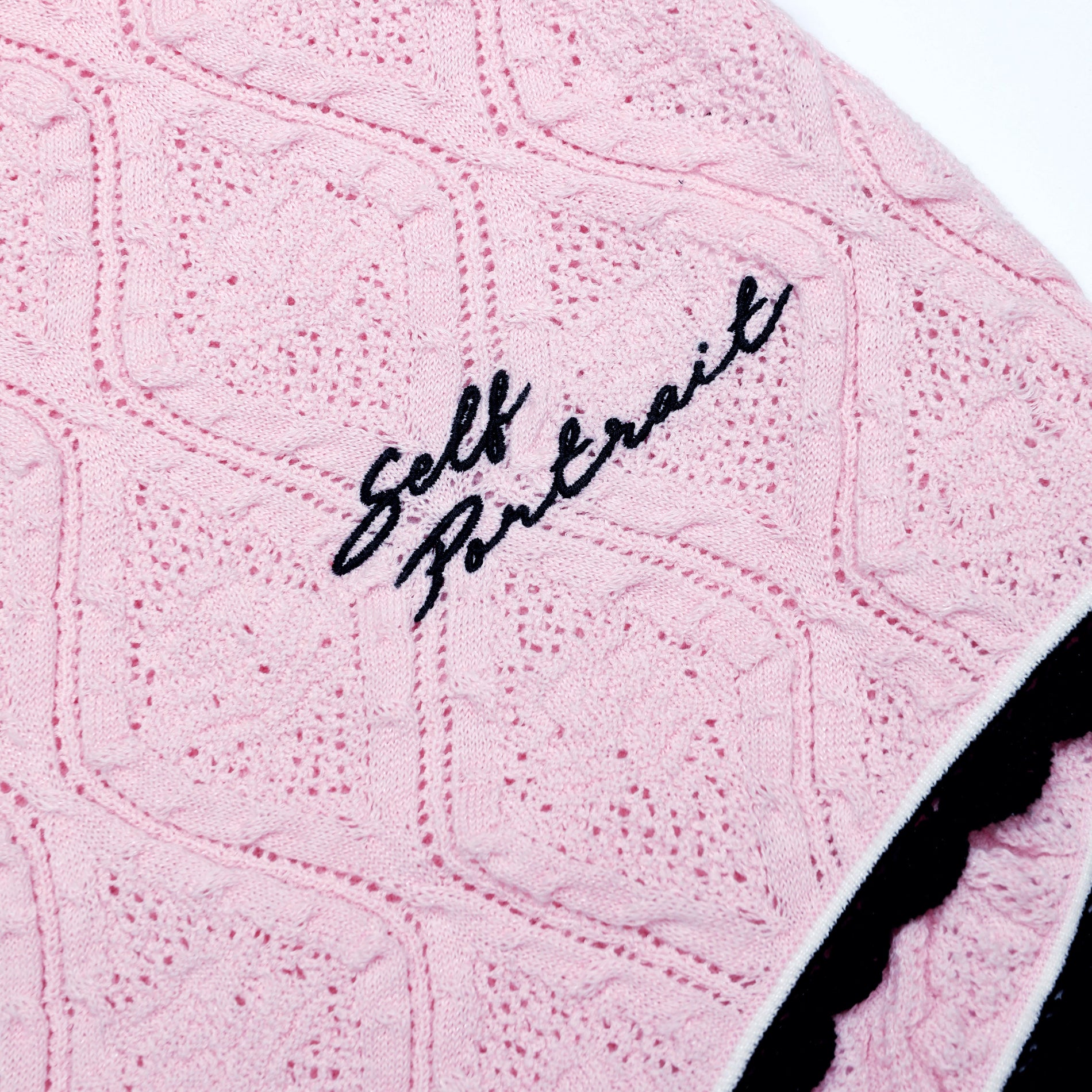 A close up of the fabric for the Pink Pointelle Knit Playsuit