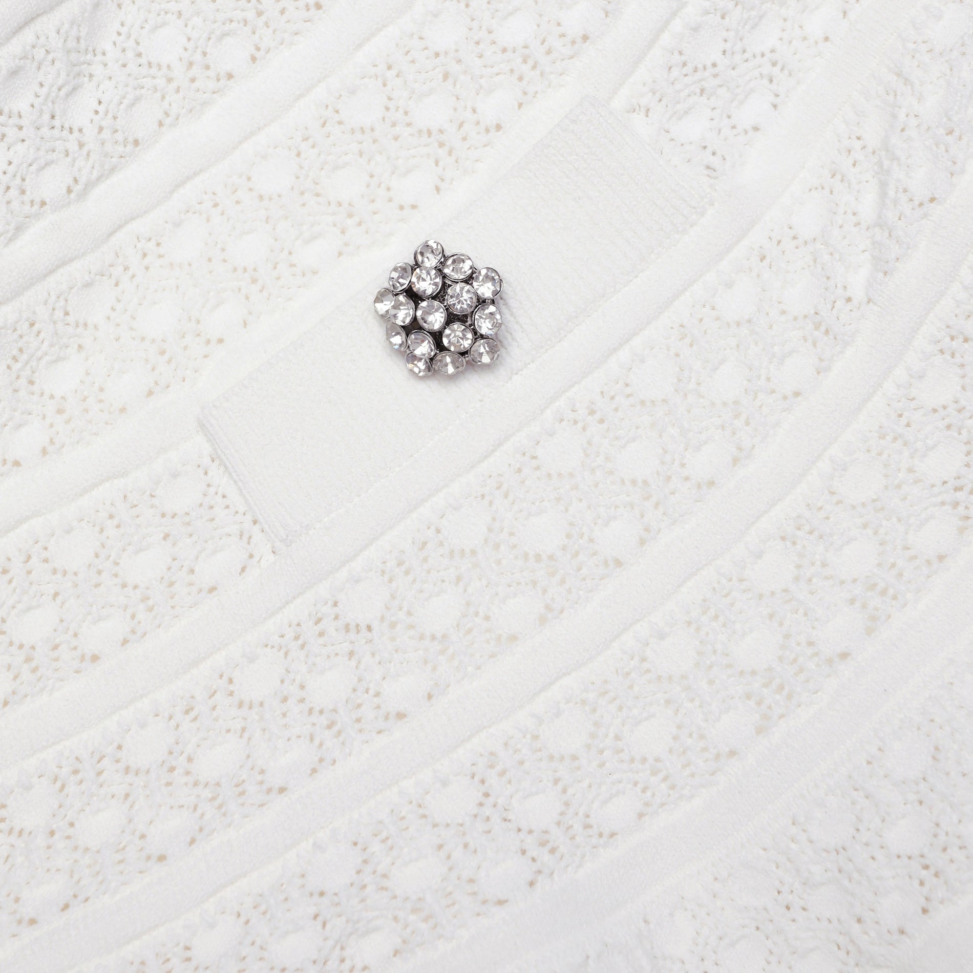 A close up of the fabric for the White Pointelle Knit Mini Skirt