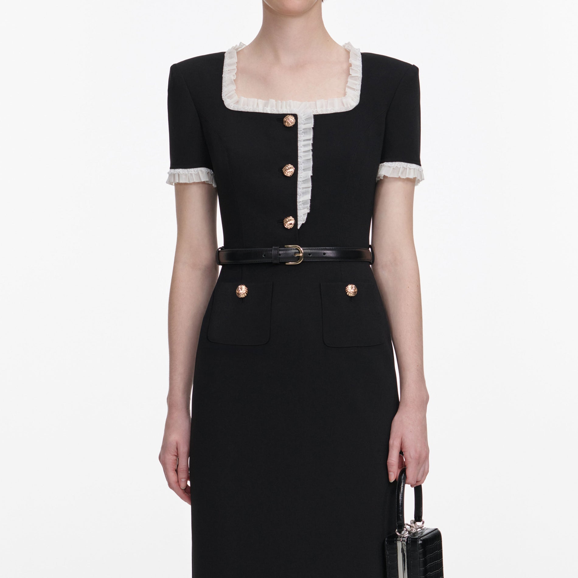 A close up of a woman wearing the Black Crepe Contrast Frill Midi Dress