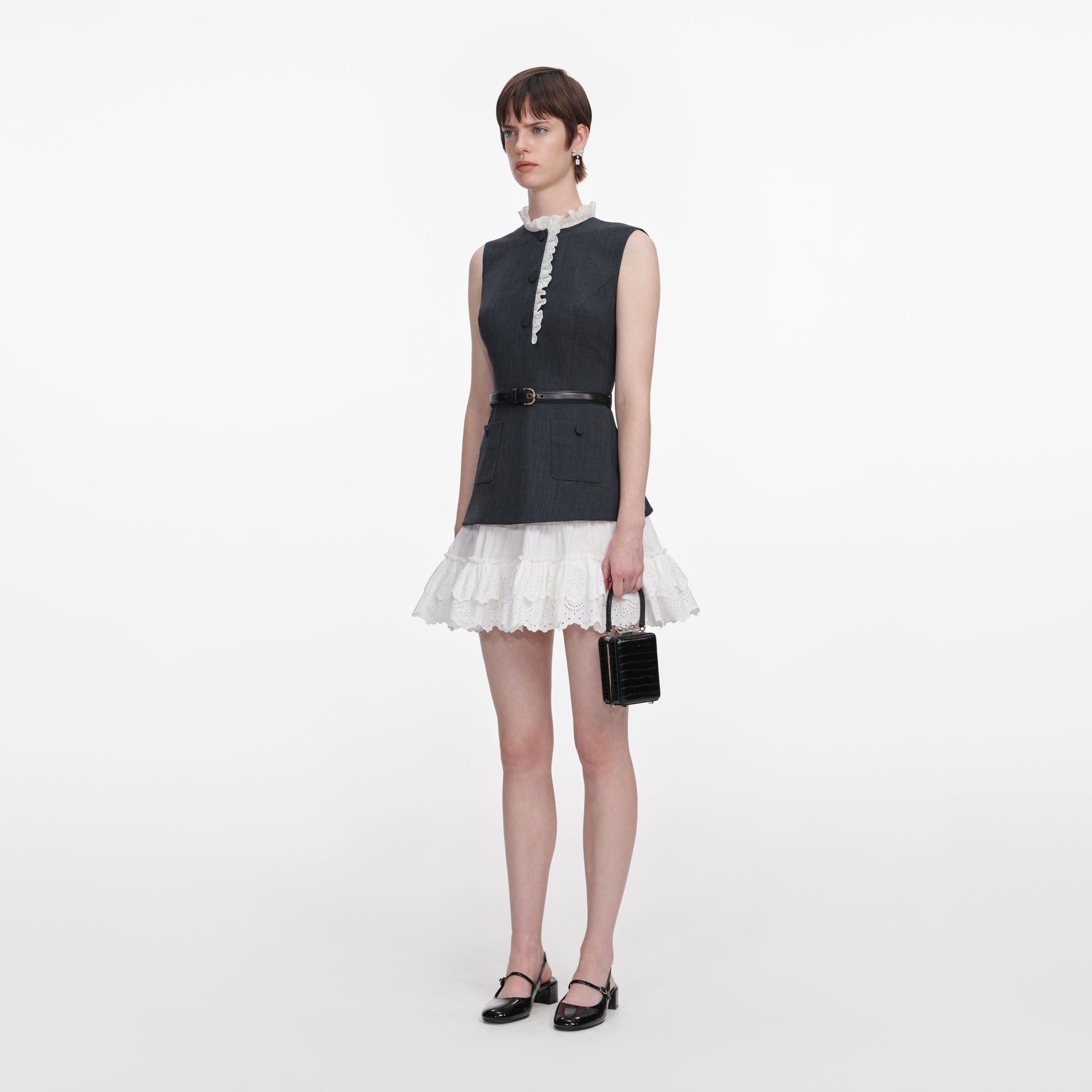 Side view of a woman wearing the Grey Tailored Cotton Frill Mini Dress