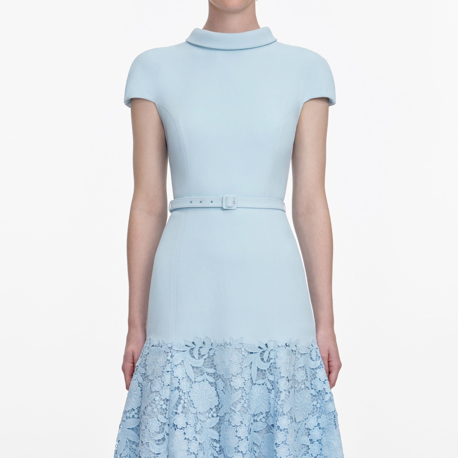 A close up of a woman wearing the Blue Crepe Lace Midi Dress