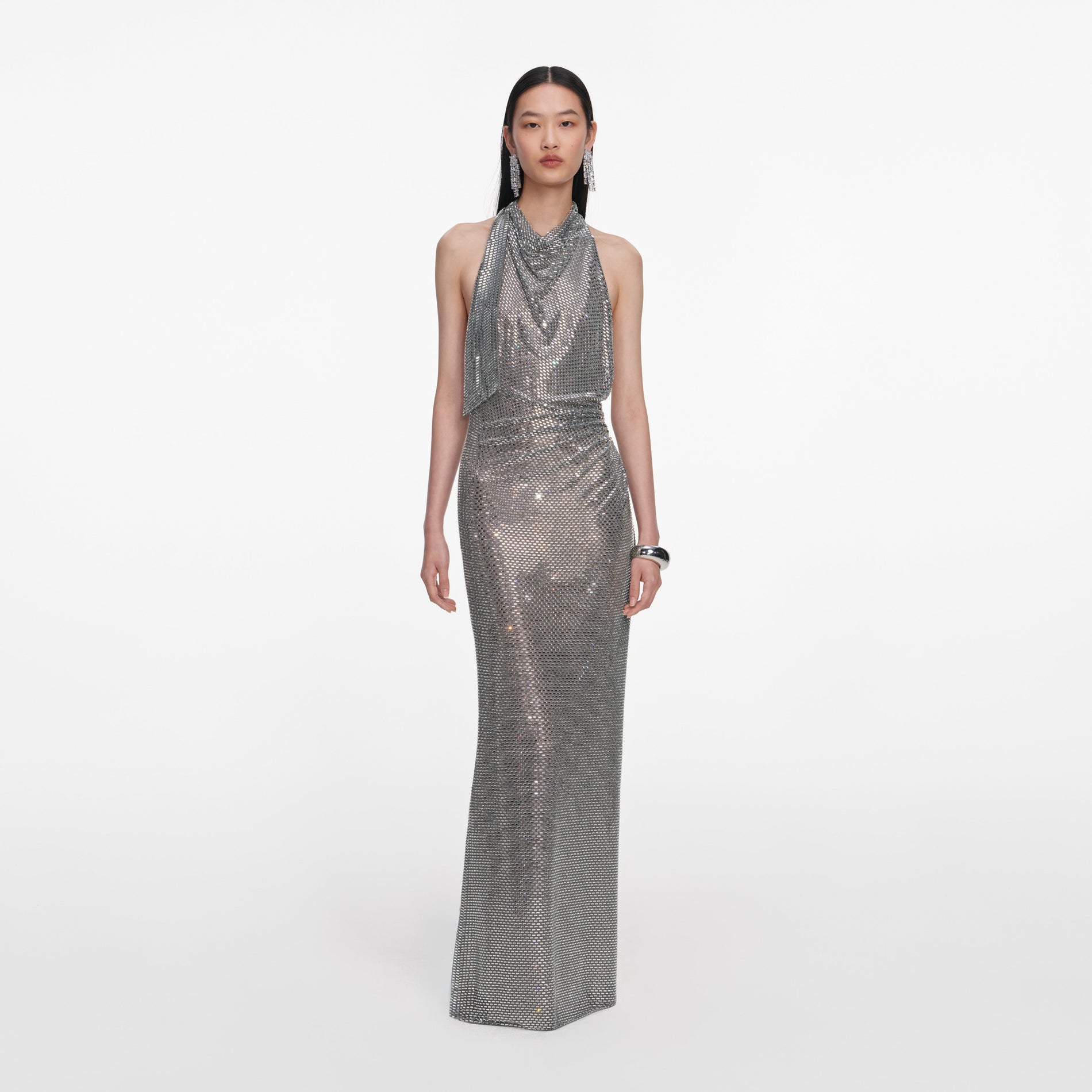 Front view of a woman wearing the Grey Rhinestone Drape Maxi Dress