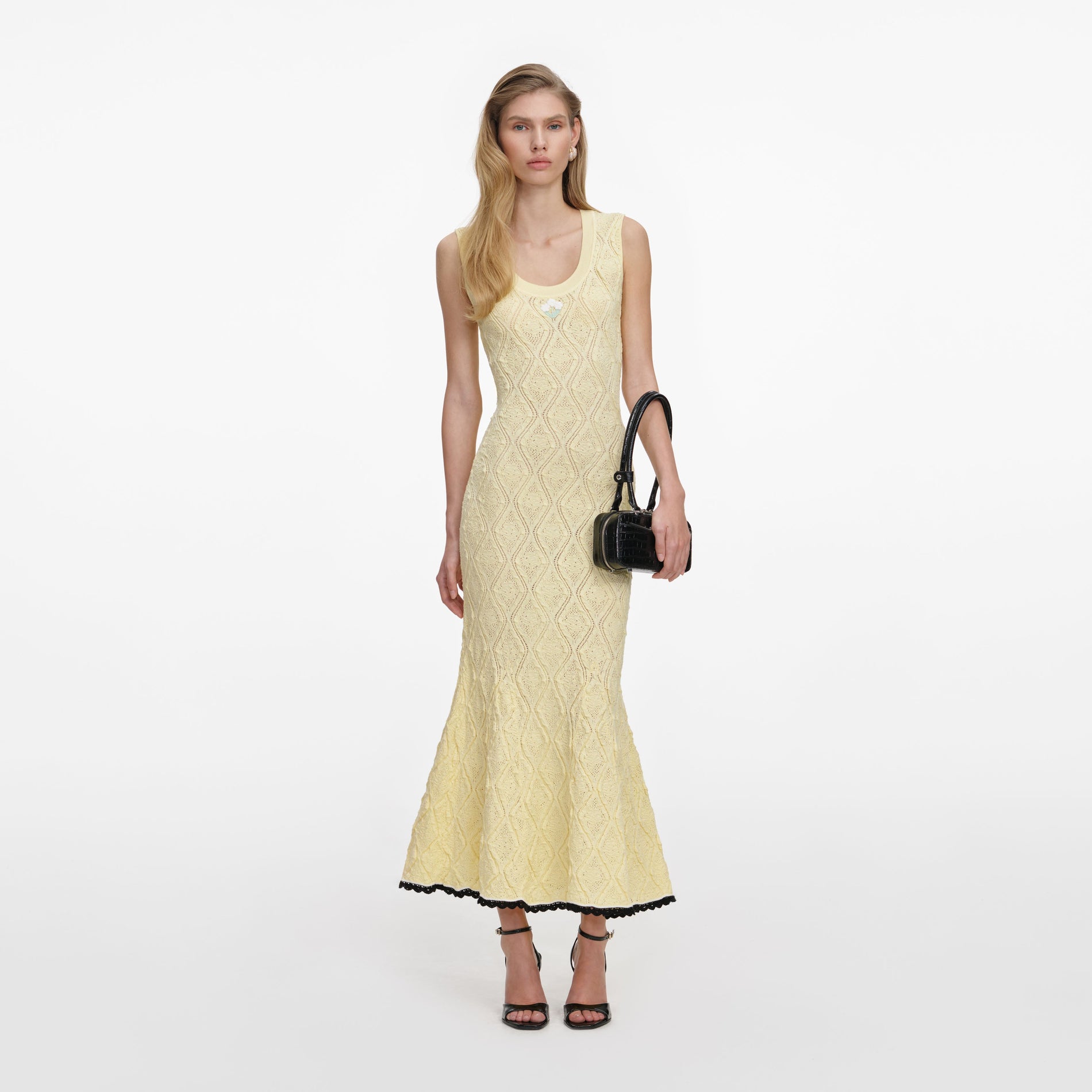 Front view of a woman wearing the Yellow Pointelle Knit Midi Dress