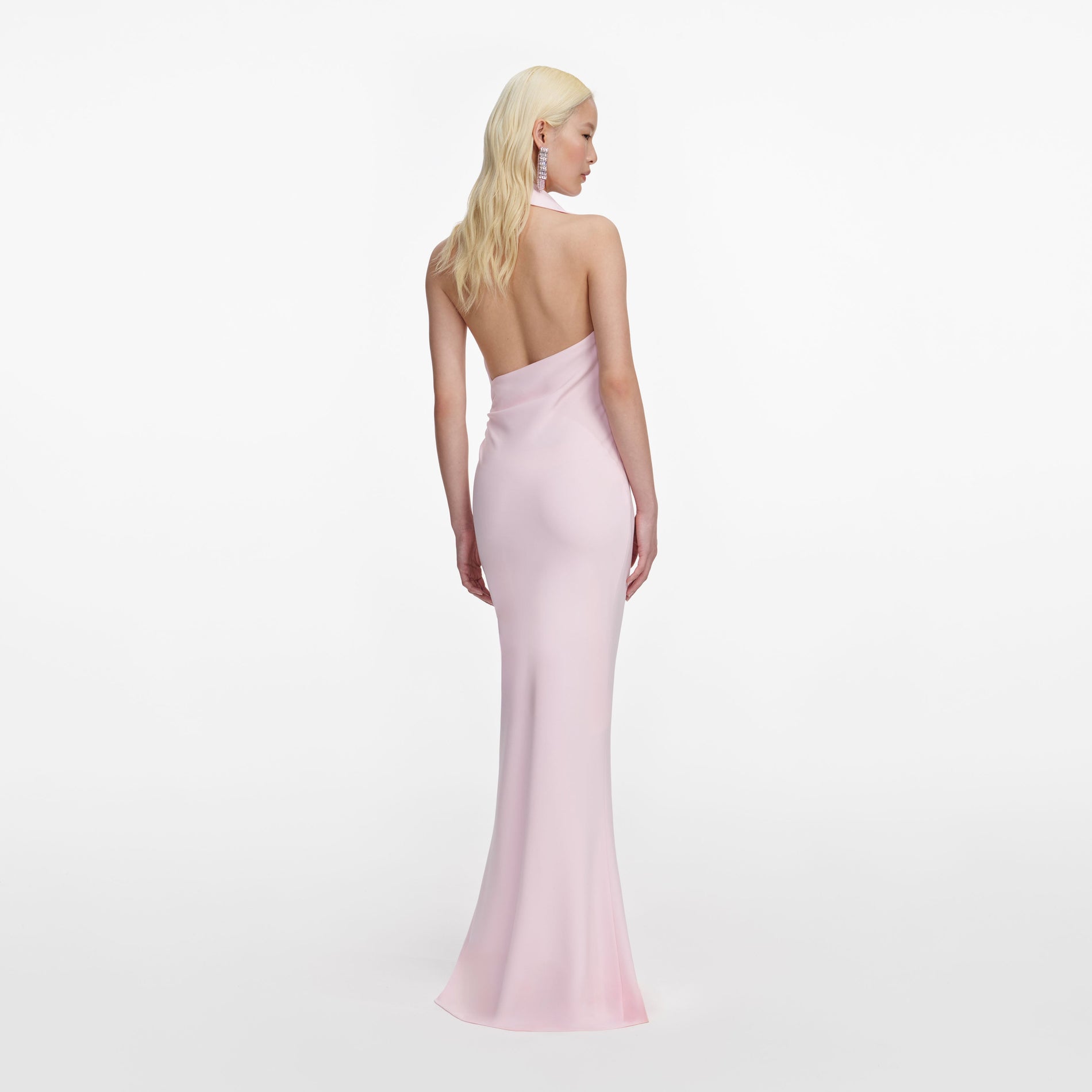 Back view of a woman wearing the Pink Crepe Halter Neck Maxi Dress