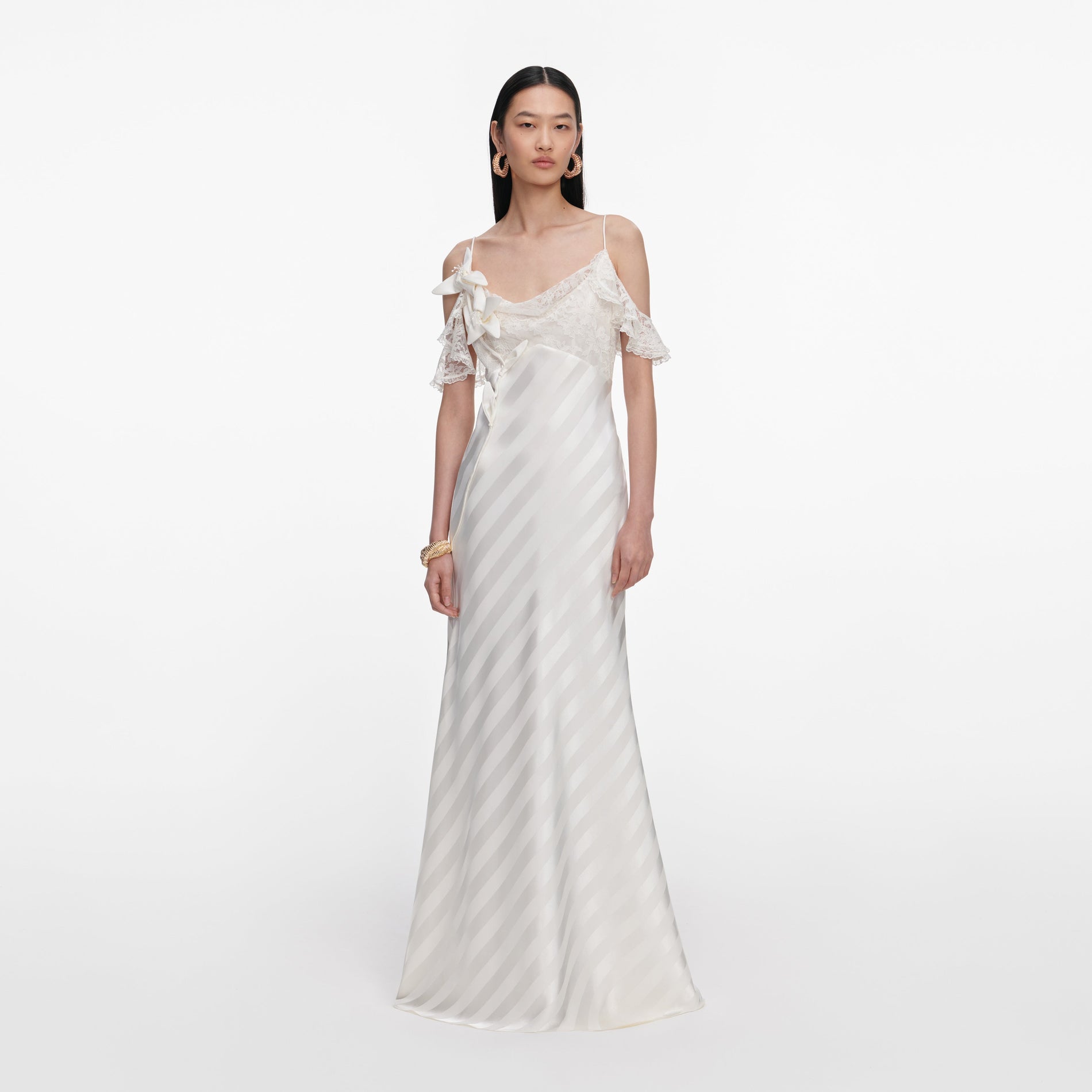 Front view of a woman wearing the Cream Satin Striped Maxi Dress