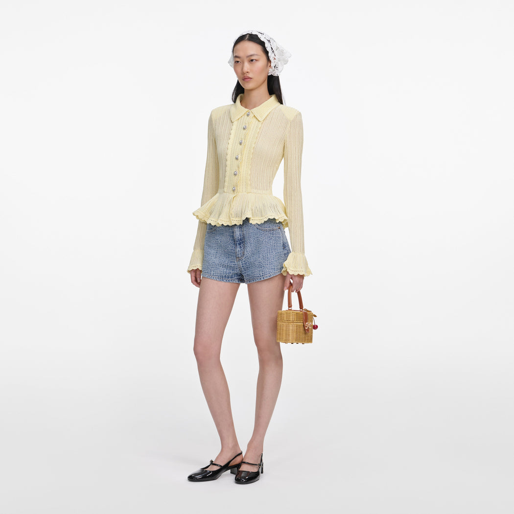 Side view of a woman wearing the Rhinestone Croc Effect Denim Shorts