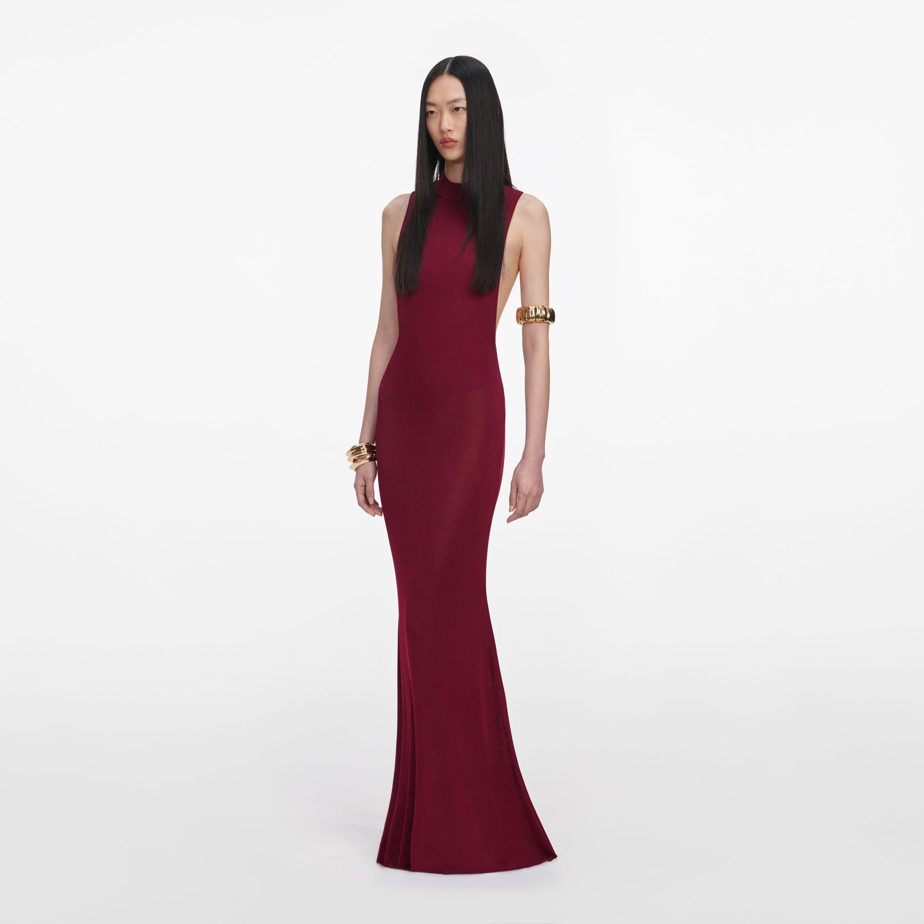 Side view of a woman wearing the Burgundy Racer Back Viscose Knit Maxi Dress