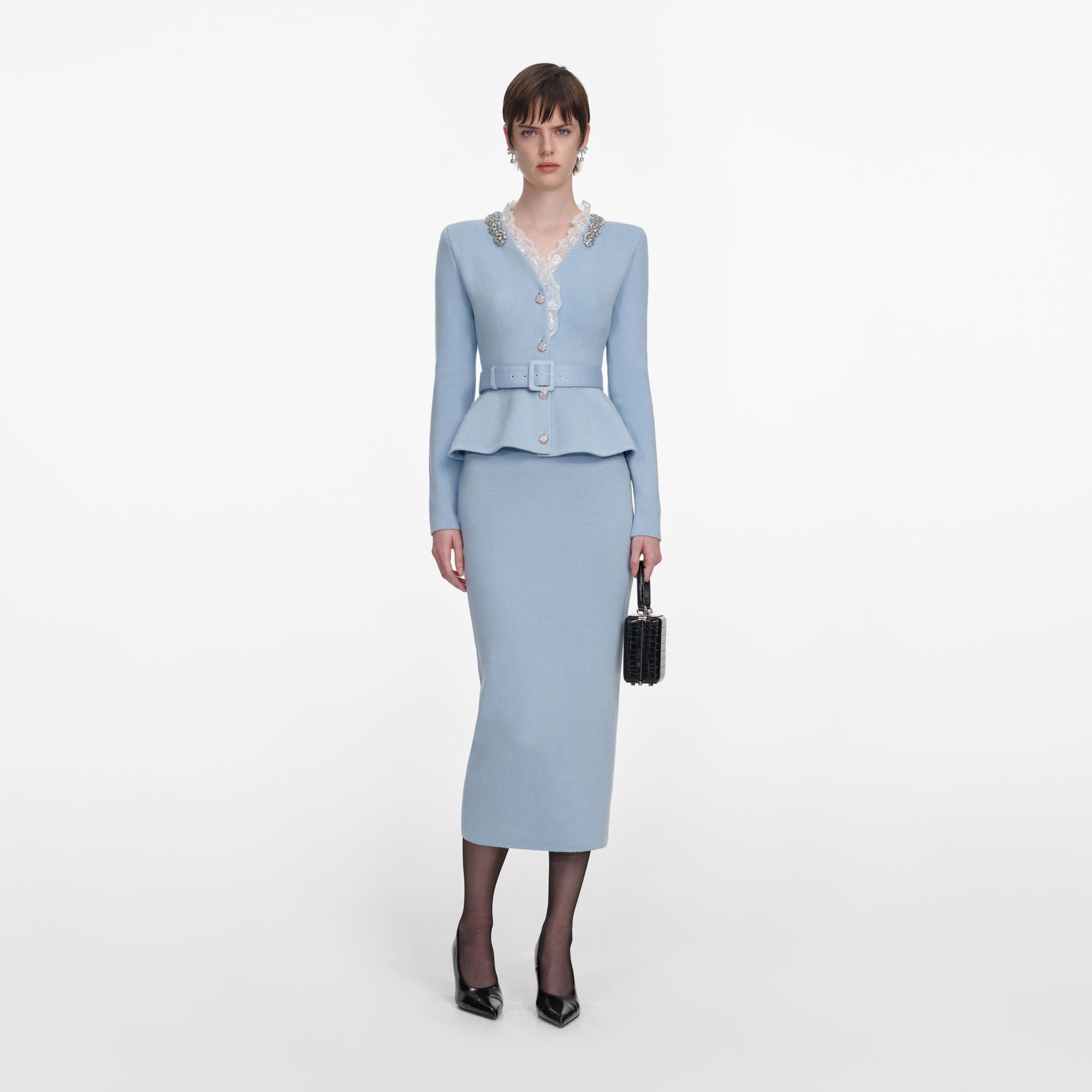 Front view of a woman wearing the Blue Crystal Trim Knit Midi Dress