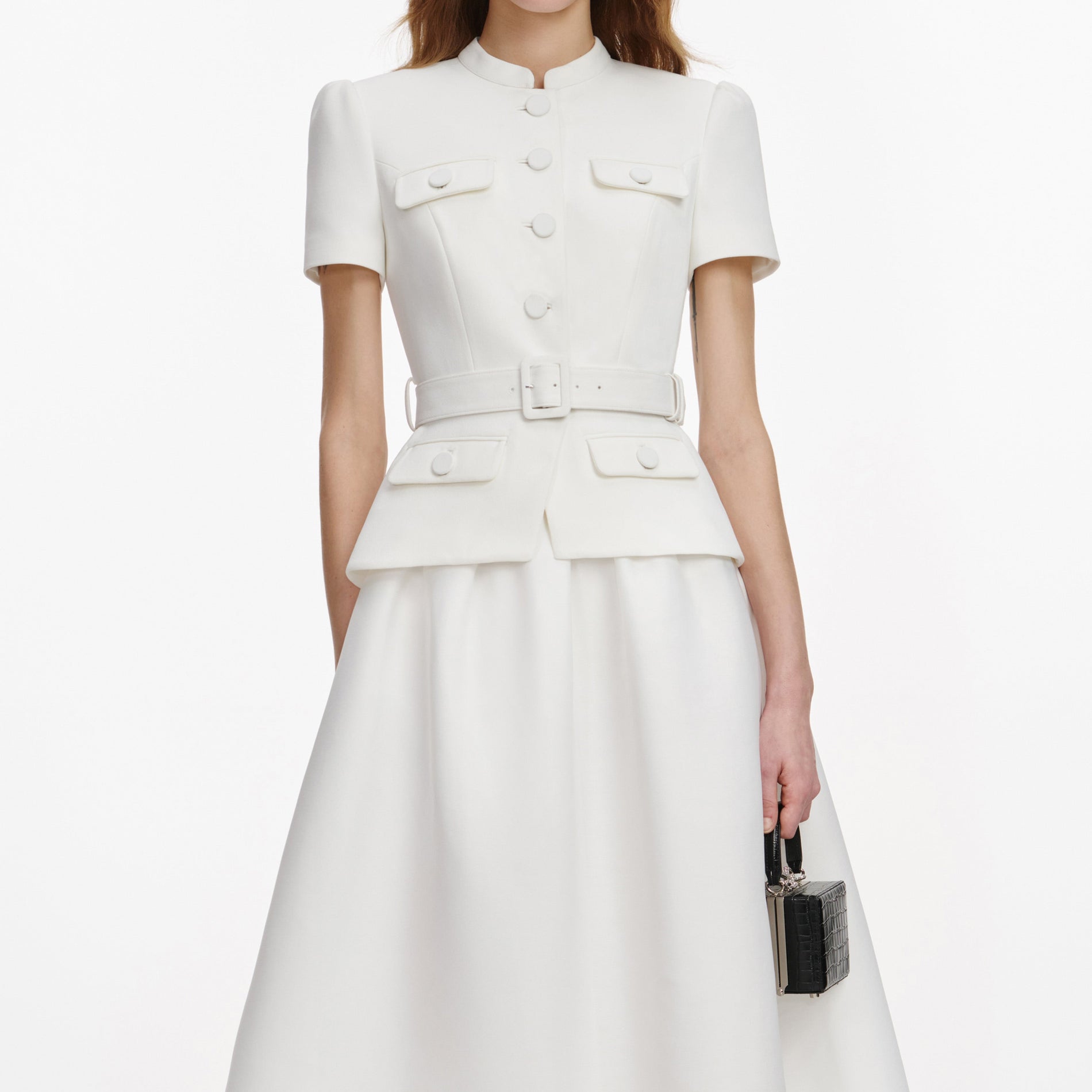 A close up of a woman wearing the White Tailored Taffeta Midi Dress