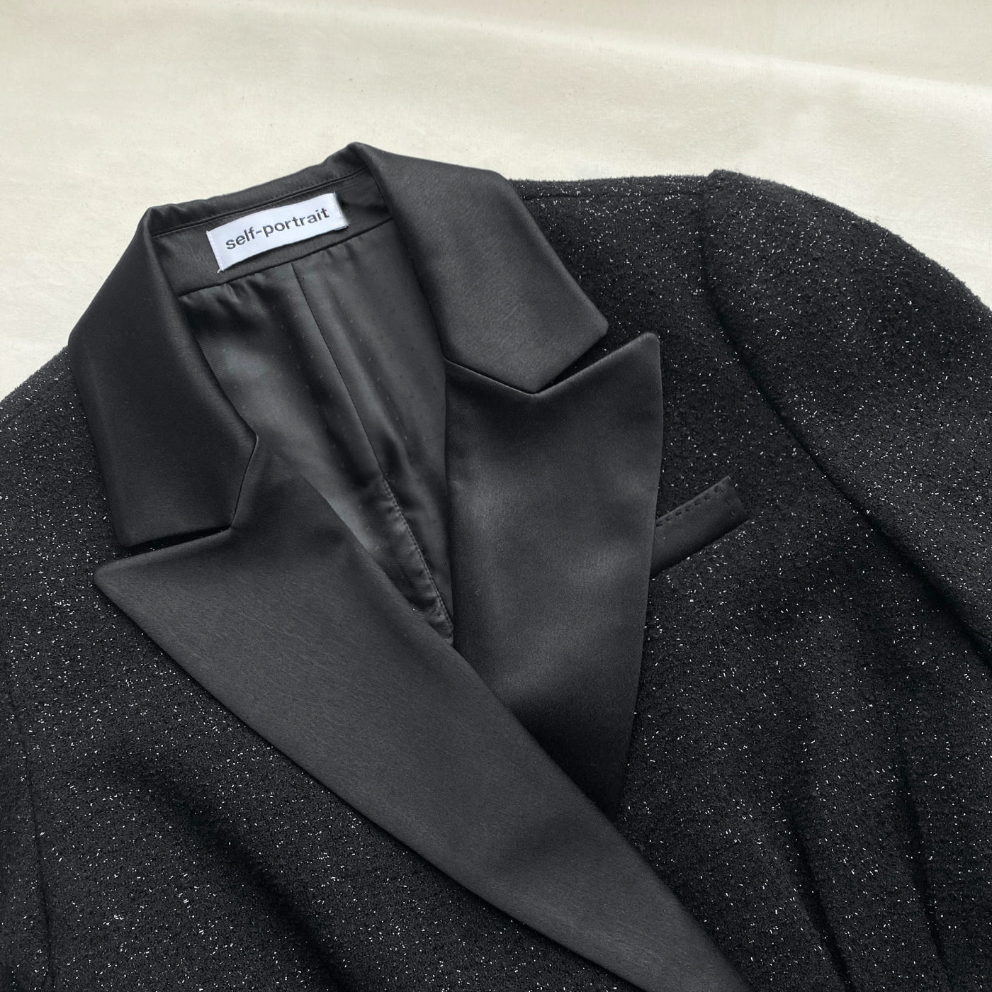 A close up of the fabric for the Black Metallic Tunic