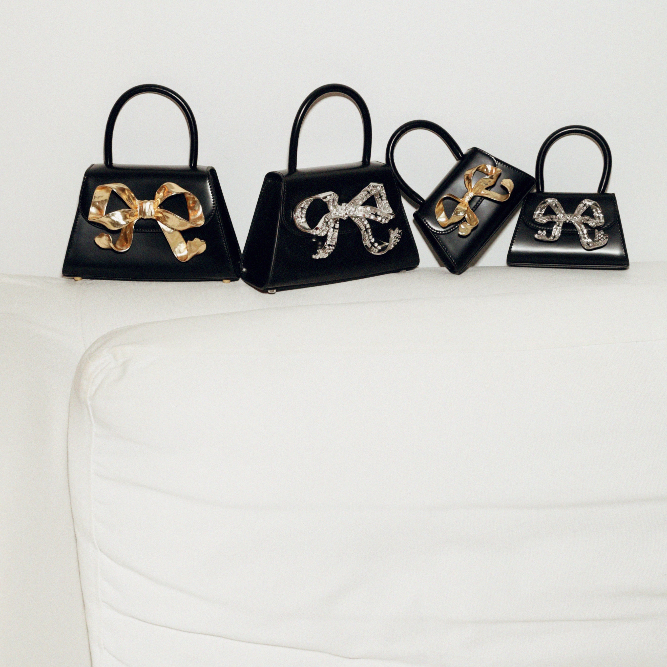 The Bow Mini in Black with Gold Hardware