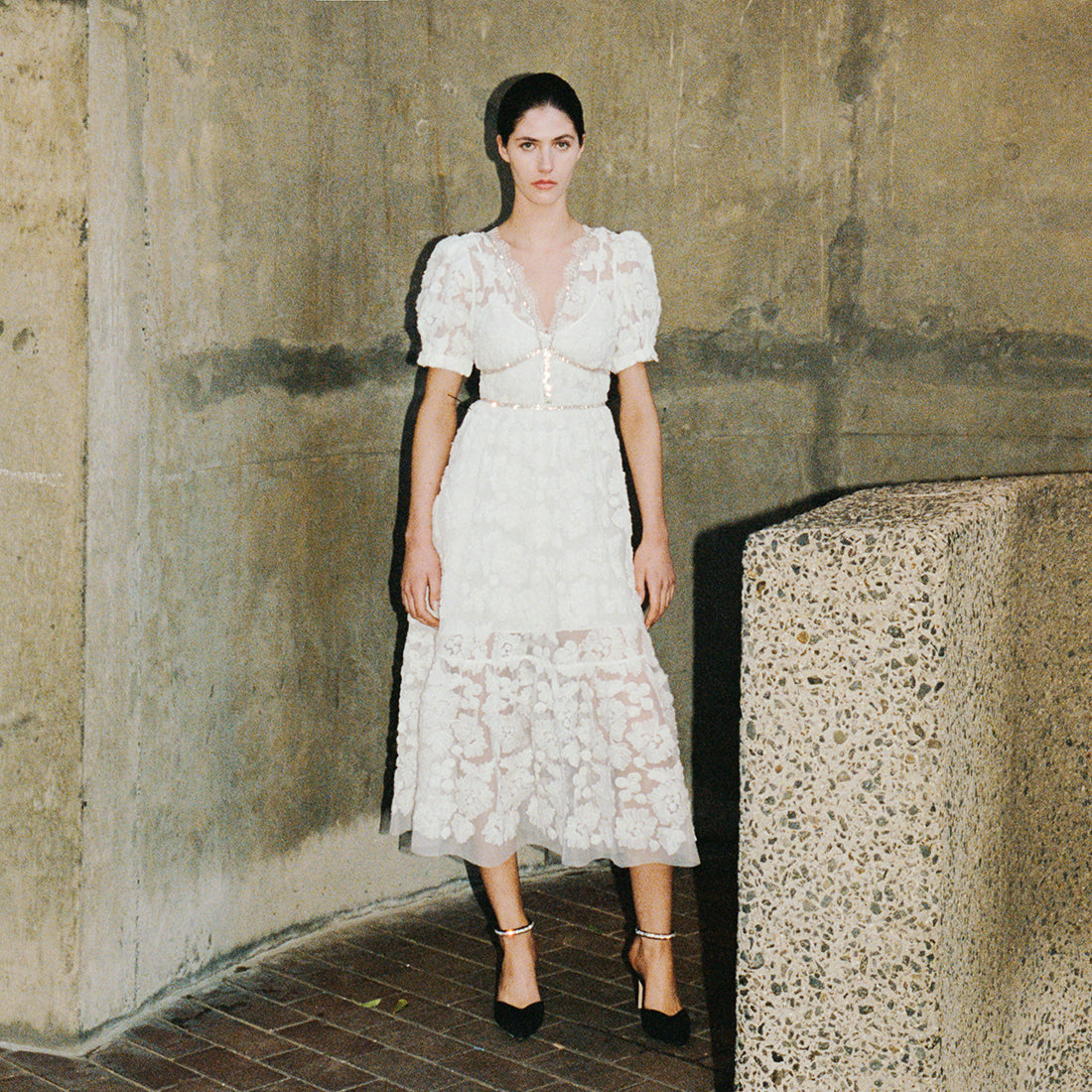 A woman wearing the Ribbon Lace Midi Dress