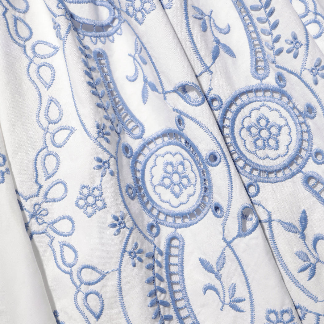 A close up of the fabric for the White And Blue Embroidered Midi Skirt